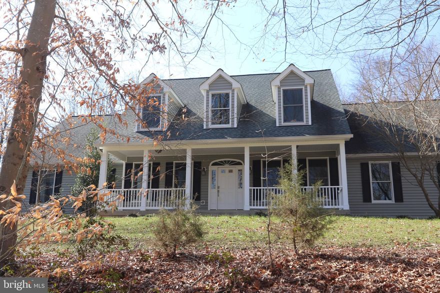 Welcome to 8765 Dominion Pl. This custom-built large Cape Cod with an 8’ wide covered front porch and a unfinished basement sits on almost 7 acres of beautiful countryside with both open fields and forest. The home features 4 bedrooms (two on the main level and two on the upper level) with space for another room upstairs (currently being used for storage). The owner’s suite is located on the main level and features his-and-hers walk in closets and of course the expected grand bathroom with two separate sink areas, a large, jetted tub and a separate double wide shower. On the main level, flooring is all either hardwood or tile. The two-story foyer and stairs are extra wide and remind you that there’s over 3,200 SF finished above ground living space and an additional 1,900 SF unfinished in the walk-out basement (that is also set up for 9’ ceilings). The upper level has brand new carpet throughout and a full bath.
 The kitchen features ample counter space and lots and lots of cabinets too, plus there’s also a center island with a cooktop and a second sink. 
 For those worried about losing power in the country, don’t. This house is equipped with a whole-house automatic start generator which will run everything. Over the last few years, the owners have updated the roof, siding, gutters, downspouts and soffits. The windows and sliding doors are by Anderson. As for the outside the house, there’s also a second driveway off of Zetta Mae Pl that leads to the large, detached garage/workshop with loft area. The deck off the kitchen and family room overlooks the back yard and some of the yard that is fenced off. On the main level, the laundry/mud room includes a front load washer and dryer and a large laundry sink. There’s a 2-car side load garage again with the extra high ceiling, and a door from the garage that enters right next to the mud room. The list goes on and on, but don’t take my word for it, come see for yourself. You won’t be disappointed. 
 BONUS! There is no HOA to control what you do with your house and property either.