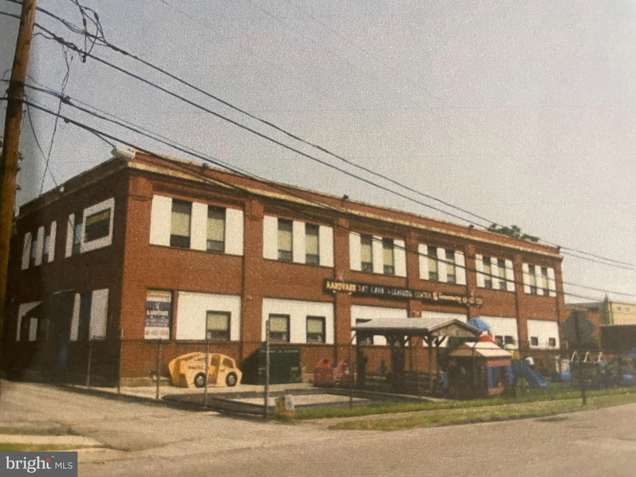 This property is an older (CIRCA 1950) light industrial building that has been converted to a multi-tenant layout, with a day care & learning center previously occupying the two-story wing at the west end of the property, while the original one-story wing , at the east end is utilized for a company's storage area . There is also a newer single-story garage wing at the rear for potential storage use. The property is ready for Bank financing - Phase 1 and Phase 2 environmental have been completed and signed off on with the $30,000 expense already incurred by the current owner.