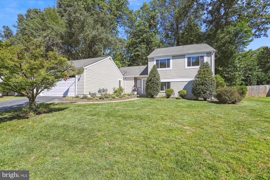 Fantastic opportunity for a spacious and light-filled home in Reston! This 5 bedroom 3 bath home is move in ready recently updated with refinished hardwood floors, new carpeting, new lighting and fresh paint throughout!  Beautiful large living and dining rooms with hardwood flooring, vaulted ceilings and French doors to the massive deck. Spacious, table space kitchen also with vaulted ceiling, silestone counters, stainless steel appliances, an abundance of cabinet space and walk out to the private deck or extra-large mudroom with built-in seating.  On the top level are four generous sized bedrooms and 2 full baths. Kitchen and bathrooms were completely renovated approximately 10 years ago and still look new!  Half level from the kitchen is a 5th bedroom, full bathroom and great family room with cozy fireplace, perfect for game nights or watching a movie. Off the family room is a sun room with vaulted ceilings, skylights and a view of the nature filled backyard. The expansive deck with built in seating is perfect for outdoor entertaining and barbeques. Oversized two car garage. This home has easy access to Reston’s 55 miles of pathways perfect for nature walks/exercising, as well as connecting neighborhoods, recreation areas and shopping centers. Convenient location to Reston Town Center, Dulles Airport,  Wiehle/Reston Metro station, shopping, dining and more! No Reston HOA or Reston Association fees to add to the budget! Fox Mill Woods Swim and Tennis Club membership available. Don't miss the chance to see this incredible home!