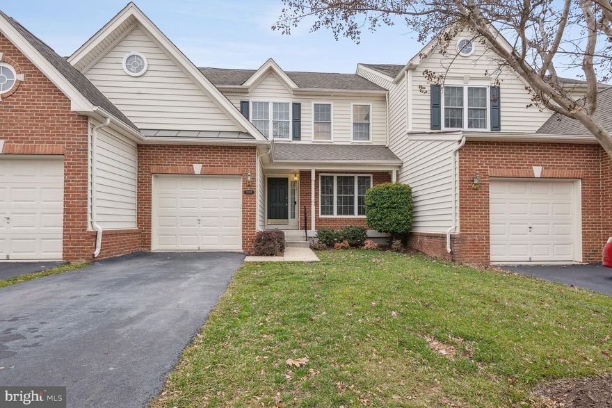 Fantastic 2,500 sq. ft. townhome with a one-car garage, ideally located in the gated, private community of Dominion Valley! Freshly updated throughout with upgraded paint, refinished hardwood floors, recent carpet, and updated stainless steel kitchen appliances. The main level features hardwood floors and a gourmet eat-in kitchen complete with granite countertops, center island, new flooring, and a spacious dining area with walk-out access to the rear deck. The inviting family room offers a cozy gas fireplace—perfect for everyday living and entertaining.

The finished walk-out lower level includes a spacious recreation room with high ceilings and recessed lighting. Step outside to a huge deck with stairs leading down to a relaxing, fenced backyard that overlooks common area green space. Enjoy low-maintenance living with HOA amenities that include trash service, pools, tennis courts, and front and back lawn mowing. Gas water heater replaced in 2018, Lower level a/c replaced in 2017, Upper level HVAC replaced in 2019, new appliances in 2023, refinished wood floors in 2023, Roof is covered by the HOA. Owner/Agent.