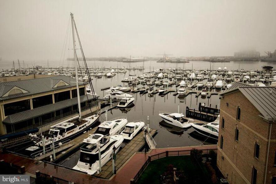 Fantastic WATERFRONT corner unit condo 3B. 2FB in Canton - 2 parking garage, balcony facing spectacular view of the Marina and Inner Harbor, hardwood floor, gourmet kitchen with SS appliances, granite counter top and breakfast bar-Master bedroom with walking closet-24h security front desk - walking distance to the new Canton Square Mall! Easy access to JHP, 95, 695, 895.