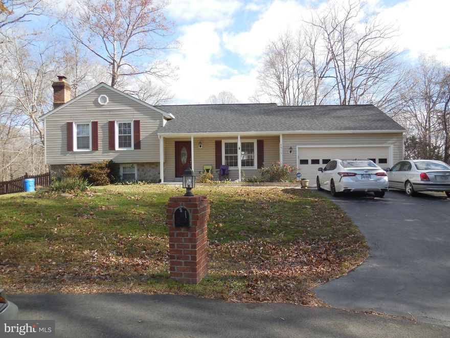 Enjoy natures beauty w/amazing sunrise and sunsets, rolling hills and mature trees. This is the perfect place to entertain with lots of privacy, 1+ acre lot, quiet cul-de-sac,  large front porch and huge back deck. Big master bedroom with his/hers closets and master bath. Light and bright open floor plan on main level with living/dining room combo and kitchen.  Inviting basement with a cozy family room with a fireplace and half bath. All you need is a little TLC and this property will shine!!!