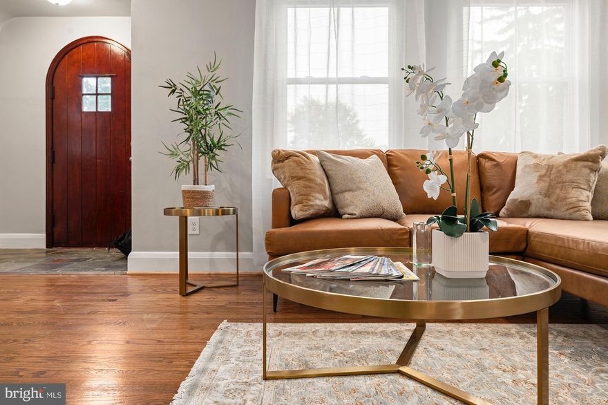 Welcome to this beautifully maintained home in the charming Waltherson neighborhood, known for its unique single-family residences and lush, green yards. Nestled among mature landscaping, this home offers exceptional curb appeal and a warm, inviting presence from the moment you arrive.

Step inside to discover the character and charm of original, resurfaced hardwood floors and a graceful arched entryway connecting the living and dining rooms—adding a touch of vintage elegance to the home's classic layout.

The updated kitchen is a true highlight, featuring a central island, crisp white shaker cabinetry, striking exotic granite countertops, new stainless steel appliances, and thoughtful design—perfect for both everyday living and entertaining.

Just off the dining room, you’ll find a delightful all-season room—ideal as a family room, extended dining area, or a serene retreat to enjoy garden views year-round.

Upstairs, you’ll find three well-proportioned rooms and a beautifully renovated full bathroom. The bathroom showcases elegant Italian marble wall tile and a herringbone-patterned marble floor, combining timeless luxury with thoughtful design.

The finished, walk-out basement with a private side entrance provides additional living space, complete with a full bathroom—perfect for guests, a home office, or a potential in-law suite.

Additional upgrades include a new HVAC system, a new roof, and new appliances, ensuring comfort, efficiency, and peace of mind.