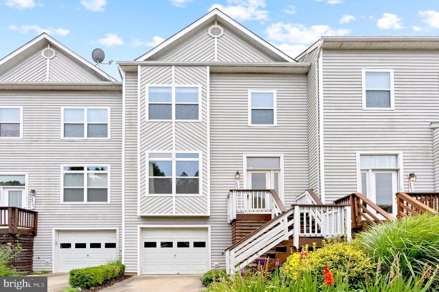 WATER VIEW & ACCESS! 3 bedrooms, 2 half baths, and 2 full baths. Upon the front entrance, you are welcomed by gorgeous hardwood flooring that takes you through the large living room with an open concept area that leads to the den and kitchen space. Within the kitchen you will find ample storage with white shaker style cabinets paired with black hardware, and gorgeous granite countertops. Right off the kitchen is a dining room featuring large glass sliders that welcome an abundance of natural lighting. Outside of the glass sliders is a sizable deck and grassy backyard, great for entertaining! The top level holds all three bedrooms, including a grand primary bedroom with an ensuite and loft area. With this rental you can have it all, including a partial view of the water that is just steps away from water access!