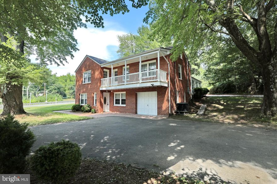 This home is nestled on a picturesque lot, exuding charm and warmth from the moment you set eyes on it. As you approach the front entrance, you're greeted by a well-maintained exterior and a lovely, landscaped yard.  The main living area boasts an open floor plan, allowing for seamless flow between the living room, dining area, and kitchen.  The kitchen has granite countertops and custom cabinetry.  Large windows flood the space with natural light, creating a cheerful ambiance throughout.  There are hardwood floors and new carpeting throughout.  One of the standout features of this home is the sunroom. Located just off the main living area, it offers a tranquil retreat where you can relax and soak up the sun's rays all year round. The sunroom is designed with floor-to-ceiling windows, offering panoramic views of the surrounding greenery and allowing you to enjoy the beauty of nature from the comfort of your own home.  This outdoor space provides a private oasis where you can unwind, entertain guests, or simply bask in the fresh air.  The home also includes a convenient garage, providing secure parking and additional storage space. Whether you have a car, bicycles, or other recreational equipment, the garage ensures that your belongings are kept safe and protected.  The 3 bedrooms are cozy and well-appointed, offering a peaceful retreat for rest and relaxation. The main suite features ample closet space, an en-suite bathroom, and access to the balcony, allowing you to enjoy your morning coffee or evening sunsets.  The lower level has the potential for an in-home business with office space, or a 4th bedroom.  This charming home combines indoor and outdoor living seamlessly, offering a serene environment where you can enjoy the beauty of nature, entertain guests, and create lasting memories.