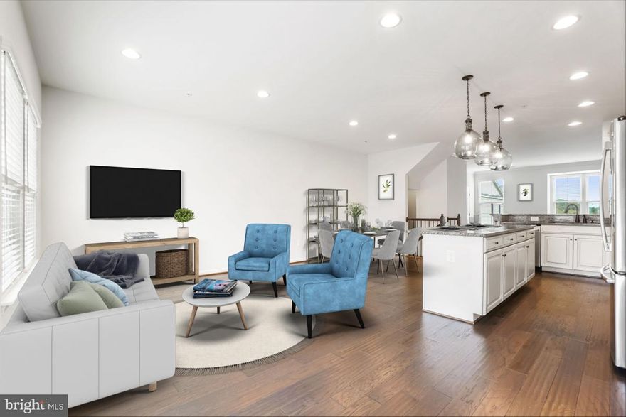 STUNNING three Level Townhome with  Hardwood floors throughout entry level, main level and hallway of upper level, oak stairs w/wrought iron railings, carpeted bedroom.  And, Oh what lovely views of green space from both the front and back windows in this lovely pristine townhome! s.  Entry level with a spacious recreation room; TWO closets; FULL bath rough-in with a storage closet; and two car garage entry.  Main/2nd level boasts Gourmet kitchen with upgraded stainless steel appliances, granite counters, large island w/3 large elegant pendant lights, dining area, family room with access to large deck, living room with bump out window and half bath. Recessed lights throughout the main and upper levels. Upper level with large Primary bedroom with large walk-in closet, ensuite bath with ceramic tile, shower and soaking tub.  Separate laundry room with GE washer and dryer.  Two additional carpeted bedrooms and full hall bath complete the upper level. No need to worry about parking with your 2 car garage plus ample parking both in the front and back of the house.  Enjoy ALL the amenities that Urbana has to offer which are MANY.............  Please call helpful LA with any/all questions.