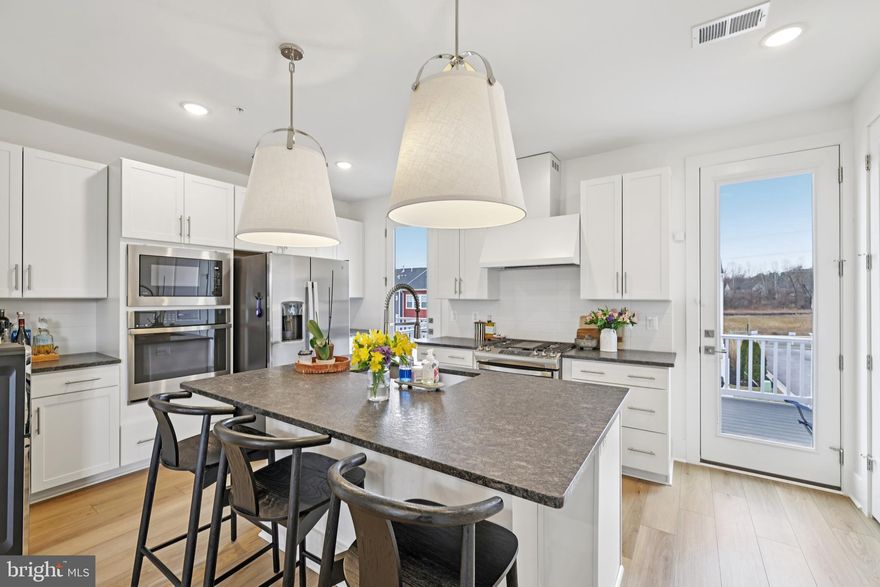 Recently adjusted price! Well-priced in this community-Don’t miss this opportunity! Welcome to 1600 Blacksmith Way in the heart of Frederick, a beautifully maintained 4-bedroom, 3.5-bath townhome offering space, style, and exceptional flexibility.
Built by K. Hovnanian Homes, this sought-after Cape May model showcases a thoughtfully designed layout with high ceilings on every level and abundant natural light throughout. A standout feature is the first-floor ensuite, currently used as an office, offering ideal flexibility for an office, guest room, or multi-generational living.
The third-floor hosts three additional bedrooms, including the spacious primary suite with its own ensuite bath, creating a comfortable and private retreat. Recent updates enhance both style and comfort, including luxury vinyl plank (LVP) flooring throughout the first and second floors and wood floors on the stairways and entrance level. 
The spacious open-concept living area creates an inviting atmosphere, highlighted by a large kitchen island, stainless steel appliances, and seamless flow for everyday living and entertaining. Generous storage options throughout the home add to its practicality.
Outside, convenience continues with a rear-entry garage and impressive parking capacity, driveway space for up to four vehicles plus additional parking directly in front of the townhome.
Residents enjoy access to community amenities including a jog/walk path and picnic area, all while being just minutes from vibrant downtown Frederick’s shopping, dining, and entertainment. Commuters will appreciate easy access to major routes including Interstate 70, Interstate 270, and U.S. Route 15.
This well-appointed home offers a flexible and functional layout with thoughtful upgrades throughout, combining modern comfort, convenience, and an ideal location. (Capital Contribution fee applies.)
