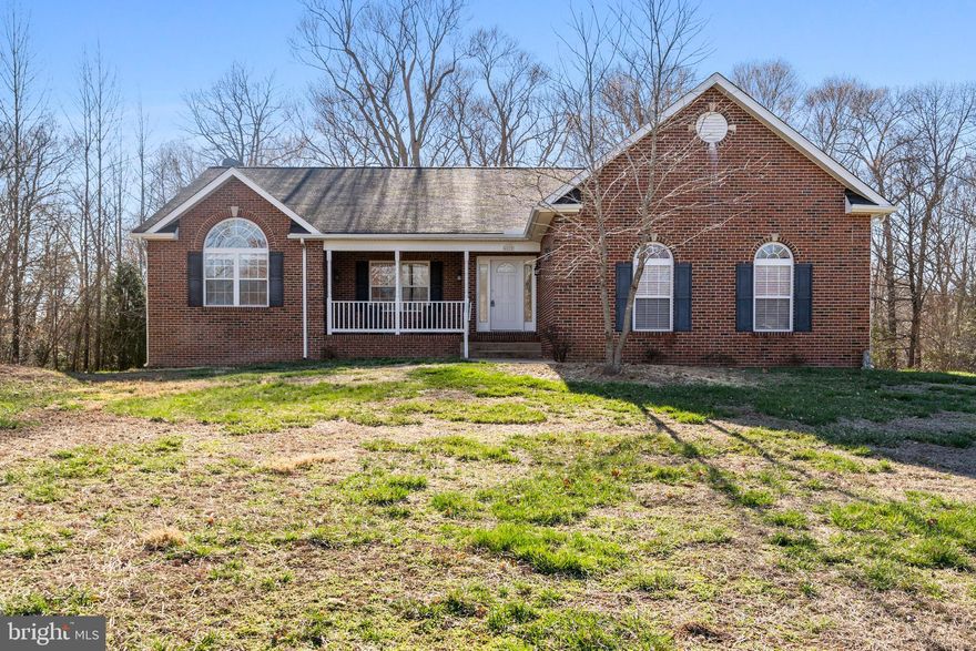 Welcome to this beautiful brick-front rambler offering over 3,000 square feet of living space! This home features an open floor plan and a split bedroom layout….creating an inviting flow throughout. The spacious kitchen is equipped with granite countertops and opens to a cozy family room with a fireplace, perfect for entertaining or relaxing. Convenient main-level laundry adds to the home's functionality. Sit on the front porch after a long day, or retreat to the primary suite... complete with an attached bath featuring a soaking tub and a walk-in shower. The partially finished basement provides a 4th bedroom, a full bath, and ample space for future expansion to suit your needs. Step outside to the walk-out level where you'll find easy access to a private backyard patio, perfect for enjoying the serene view of the wooded backdrop. 2 car garage. With no HOA, you have the freedom to make this home truly your own. Don’t miss out on this fantastic opportunity!