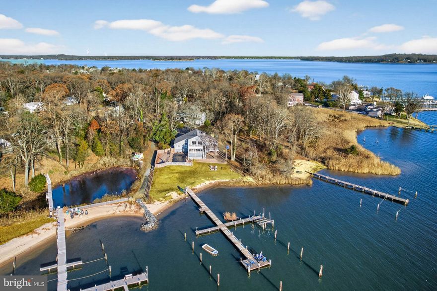 Waterfront Living at Its Finest with Private Sandy Beach and Deep Multiple Slip Pier

Discover the perfect blend of comfort, beauty, and the Chesapeake Bay lifestyle in this exceptional 5-bedroom, 3-bathroom waterfront home, nestled on a serene .52-acre lot in the sought-after community of Weatherly. From your own sandy beach to a multiple slip deep-water pier with 4'+ MLW, this property offers the rare opportunity to live each day surrounded by the best of coastal Maryland.

Inside, the main level welcomes you with warm hardwood floors, vaulted ceilings, and walls of windows that pull the water views into every corner of the home. The spacious living room features a striking cathedral ceiling and wood burning fireplace with mantel and opens to an expansive deck overlooking Deep Creek, the Magothy River, and the sparkling Chesapeake Bay beyond—an ideal setting for morning coffee, evening sunsets, or year-round entertaining.

An open-concept kitchen flows seamlessly into the dining and family rooms, all positioned to capture the abundant natural light and panoramic water views.  Enjoy crab feasts or card games your waterfront  porch    A main-level office or bedroom and a full bathroom with a walk-in shower offer flexibility and convenience for guests or multi-generational living.

Upstairs, you’ll find four well-appointed bedrooms and two full bathrooms. The primary suite includes a private ensuite with a dual vanity and walk-in shower, creating a peaceful retreat. Two additional bedrooms feature balcony access, giving you elevated vantage points of the water—perfect for savoring sunrise skies or quiet evening breezes. The fifth bedroom offers its own water view and a generous closet.

Outdoors, the shoreline becomes your backyard playground—swim, kayak, fish, or simply sink your toes into the sand.  If you prefer floating on a raft in your waterfront in ground pool---your pool is ready and waiting!

This is more than a beautiful house. It’s a lifestyle. A retreat. A place to breathe deeply and feel truly at home.

Beyond the home itself, the Weatherly community enhances your lifestyle with its community beach and community pier, all within a quiet, friendly neighborhood that feels worlds away yet remains close to everything you need.  Love the flexibility of having Broadneck Blue Ribbon public schools and the convenience of being just minutes from downtown Annapolis and an easy commute to DC and Baltimore.  

This is more than a home—it’s an experience. A sanctuary. A place where the rhythm of the water becomes part of the way you live.

Come fall in love with waterfront living and make every day feel like a vacation.  

Make Sure to View the Video Tour

Additional Parcel--1019 Landon Lane, .482 Acre Raw Land is Also for Sale--MDAA2132194

Upgrades Include:  2025-Pier Rehab included replacing 4 pilings, 50 percent of deck boards, installed new clothes dryer; 2024-Renovated Main Level Bathroom to include tile flooring, installation of oversized walk in shower with tile surround and stone flooring, toilet, vanity light fixtures and accessories, Installed privacy fence around the inground pool; 2023-Installed clothes dryer; 2022-Installed New Roof, New dishwasher,  Installed Boat lift on dock with 200 W Electric Panel Box at the Dock, Installed Reverse Osmoses Water Filtration System at the Kitchen Sink, 2019- Installed Water Heater, Installed Flow by Moen--Automatic water shut off should a pipe fail, Installed Enviro Pellet stove in the Family Room; 2018-Installed Pool Liner for Inground Pool; 2016-Installed New Refrigerator in the Kitchen