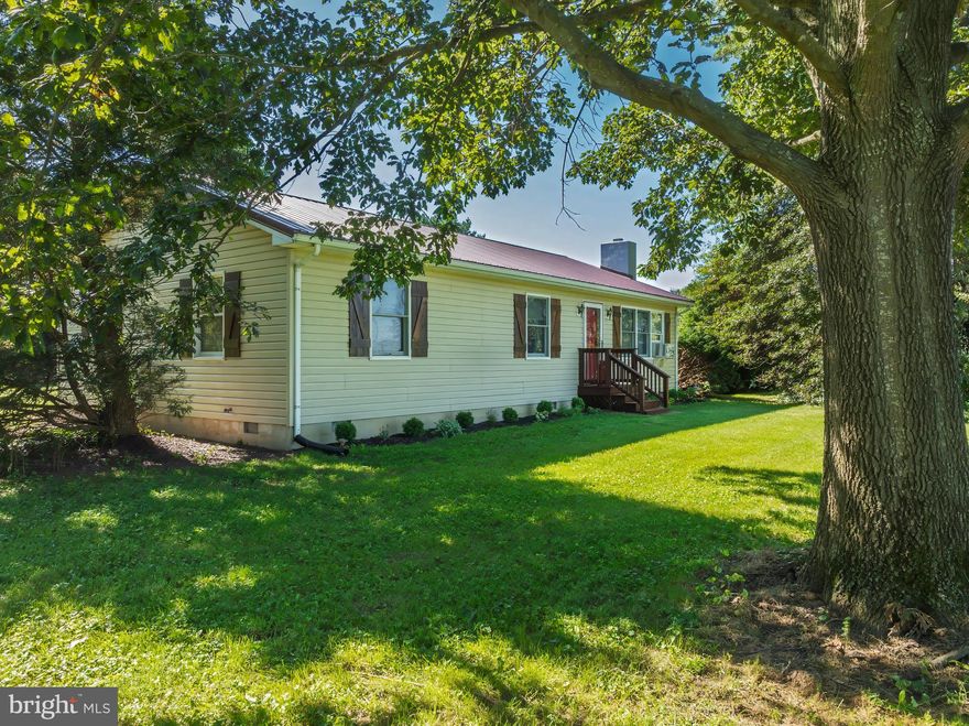 Welcome to this Hidden Gem on 1.11 Acres! Just minutes from Rt. 301, this property offers the perfect blend of peaceful rural charm and convenient access to Middletown, Dover, and Chestertown. This custom-built, one-level home features energy-efficient 2x6 construction, a partially open floor plan, 3 bedrooms, and 2 full bathrooms—providing comfortable single-story living for the whole family. Inside, enjoy the warm, rustic feel of beautiful Scotch Pine wood imported from Finland, showcased on the walls and vaulted ceiling. A new Pelpro pellet stove adds cozy cabin ambience and efficient heating during cooler months. Recent upgrades include: Metal roof (5 years new), New front door, LVP flooring, New hot water heater, New stove & dishwasher, New shutters, New pool pump, Fresh landscaping, and a Fully encapsulated crawl space with dehumidifier for added peace of mind. Outdoor Living You’ll Love: Step outside to your expansive, private backyard retreat. Relax on the large covered deck, cool off in the above-ground saltwater pool (2018), or unwind year-round in the 6-person Vita Spa hot tub (2018). A True Workshop Dream: The standout feature of this property is the fully insulated, air-conditioned 24' x 32' shop/garage, equipped with: 100-amp electric service, 2-post vehicle lift, 220-volt welding receptacle, Small rear office—ideal for hobbyists or working from home. Perfect for mechanics, welders, or anyone needing space for trucks, boats, or equipment. Additional structures include an 18' x 20' lean-to with metal roof and a 40-ft shipping container for secure storage. Come tour this unique home and make your dreams a reality today!