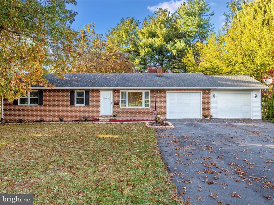 This is the solid brick rancher they just don't build anymore! Located on a flat, fenced in corner lot filled with mature shade trees. Walk out of the front door to a picturesque view of Catoctin Mountain.  Fenced in backyard with a pavilion and gazebo perfect for entertaining. Two sheds for additional storage. Plenty of parking with a double entrance, newly paved driveway leading to two separate oversized one car garages. One of which includes heat, A/C, water supply, and floor drain. Walking through the front door to the large and bright living room you will find brand new LVP flooring which stretches throughout the entire level. Three bedrooms on the main level, one with its own half bathroom. Full bathroom off of the hallway.  Formal dining room and large kitchen separate with a cabinet passthrough. We're not done yet.... as you make your way down the basement steps you will enter a huge 26x17 family room with propane brick fireplace. It could be used as a billiard room, home theater, rec room, etc.. Walking further there is yet another bedroom! Bringing it to a total of 4 bedrooms. New laminate flooring in both the family room and bedroom.  If you are entertaining downstairs don't fret... there is a full bathroom right off of the bedroom. The storage/utility area is massive. Move your large items to storage by way of the Bilco door taking you to the back yard. Rounding out the home is an updated 200A service, electric water heater, central A/C, full attic, and solid roof.