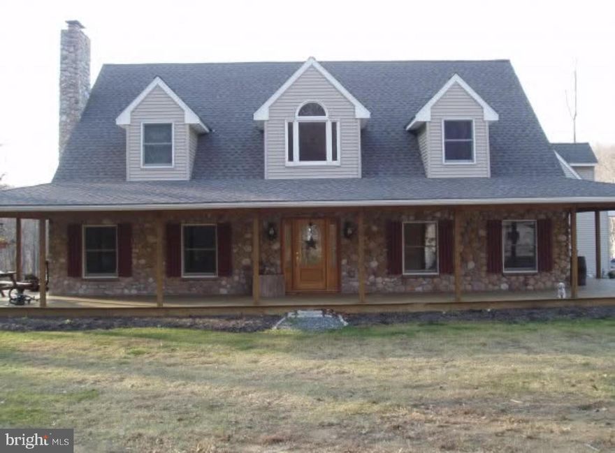 Coming Soon! Showings start 4/14/26 Experience the rare opportunity to own a 50-acre estate that seamlessly blends refined living, unmatched privacy, and exceptional agricultural potential. From the moment you arrive, this property delivers a sense of grandeur and tranquility that is increasingly hard to find. The main residence has been thoughtfully updated with new hardwood flooring throughout the first floor and staircase, complemented by freshly painted interiors that create a bright, sophisticated atmosphere. The main level is designed for both comfort and entertaining, featuring a spacious kitchen, inviting living room, elegant dining area, and a versatile bonus room—all centered around a warm, beautifully appointed fireplace. The first-floor primary suite offers a serene private retreat with its own bath, while the upper level provides three additional bedrooms, a full bath, a flexible loft space, and convenient attic storage. The lower level is a standout, offering radiant heated floors, a second fireplace, and plumbing already in place for an additional bathroom. Whether envisioned as a luxury entertainment area, guest suite, or expanded living quarters, this space is primed for customization. Radiant heat also extends into the garage, ensuring year-round comfort. Perfect for multi-generational living or hosting long-term guests, the property includes a private in-law suite with its own entrance, complete with a bedroom, full bath, kitchen, and dining area. Outdoor living is equally impressive. A charming wraparound porch captures sweeping views of the rolling landscape, offering the ideal vantage point to enjoy sunrise, sunset, and everything in between. With zoning that supports both residential and agricultural use, the possibilities are endless—equestrian pursuits, farming, hobby agriculture, or simply embracing the peace and beauty of an expansive estate lifestyle. This extraordinary property delivers the space, flexibility, and luxury rarely found in one offering. A true sanctuary for those seeking elevated living with limitless potential.