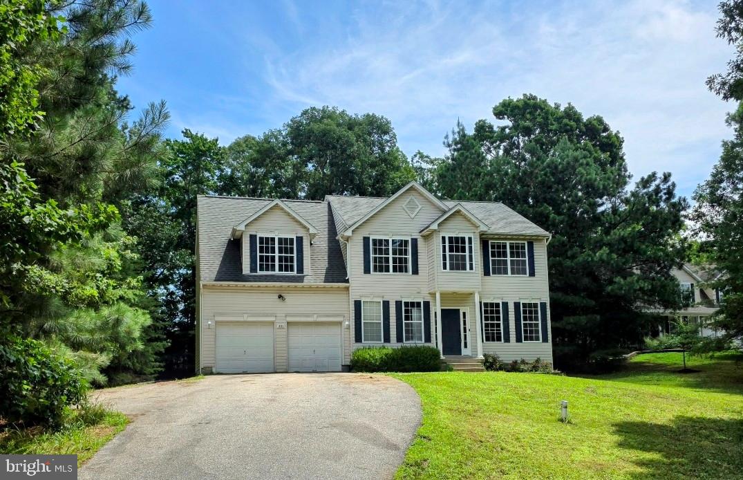 Beautiful Colonial Home on almost 1 acre with a Finished Basement & Two Car Garage! Recently Updated with Fresh Paint, Beautiful New LVT Flooring, New Carpet!!! The Main Level Features LVT Flooring * Spacious Family Room with Electric Fireplace * Kitchen with Stainless Steel Appliances & Pantry * Kitchen Table Space with Slider to the Back Yard Deck * Separate Dining Room * Separate Laundry Room & Powder Room ** Upper Level Features a Huge Primary Bedroom with Vaulted Ceiling and Beautiful New LVT Flooring along with a Spacious Primary Bathroom which has a Double Sink, Soaking Tub, Separate Shower & Walk-in-Closet * Three additional Bedrooms * Nice Hall Bath ** Lower Level Features a Recreation Room with a Sliding Glass Door which leads to the walk-up stairs to the Back Yard * Nice size Den/Office Space * Full Bath with Two Sinks & Shower * Spacious Utility Room/Storage Room ** Large Composite Deck off the back of house with a Beautiful Back Yard for Entertaining! Approximately 8 miles to PAX River Naval Base ** Conveniently located to Shopping, Restaurants, Movie Theaters, Parks, Entertainment, Chesapeake Bay, Patuxent River & more!!! **Contractor doing minor paint touchup and few updates which should be completed this week**