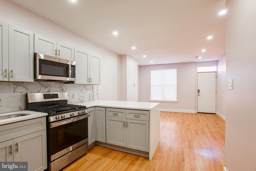 Welcome to 1317 N Myrtlewood Street!This beautifully renovated 2-bedroom, 3-bathroom row home with a bonus room in the fully finished basement is located in the heart of Brewerytown and offers a spacious, light-filled layout with stylish upgrades throughout. 

The open-concept main level flows seamlessly from the living room to the dining area and into a modern kitchen featuring stainless steel appliances, shaker cabinets, and a striking quartz waterfall peninsula — perfect for casual meals or entertaining. Just beyond the kitchen, you'll find the first of three full bathrooms, a laundry closet with stacked washer & dryer, and sliding doors that lead to a fenced-in back patio — ideal for outdoor gatherings. First month, last month and security deposit due at lease signing. Pets accepted on a case by case basis. Additional $500 non-refundable pet deposit per pet if accepted.  *

Upstairs, you'll find a sleek full bathroom off the landing, along with a generously sized bedroom with a double-door closet. The primary bedroom is located at the front of the home and includes its own private en-suite bathroom.

Not only does the  fully finished lower level offer plenty of storage, but it boasts  a nicely sized bonus room making it ideal for a home office setup, gym or guests. Each bathroom features clean white subway tile and durable tile flooring.

Prime location with coffee shops, grocery stores, restaurants, and bars just a short distance away — plus easy access to Center City, I-76, and public transit.