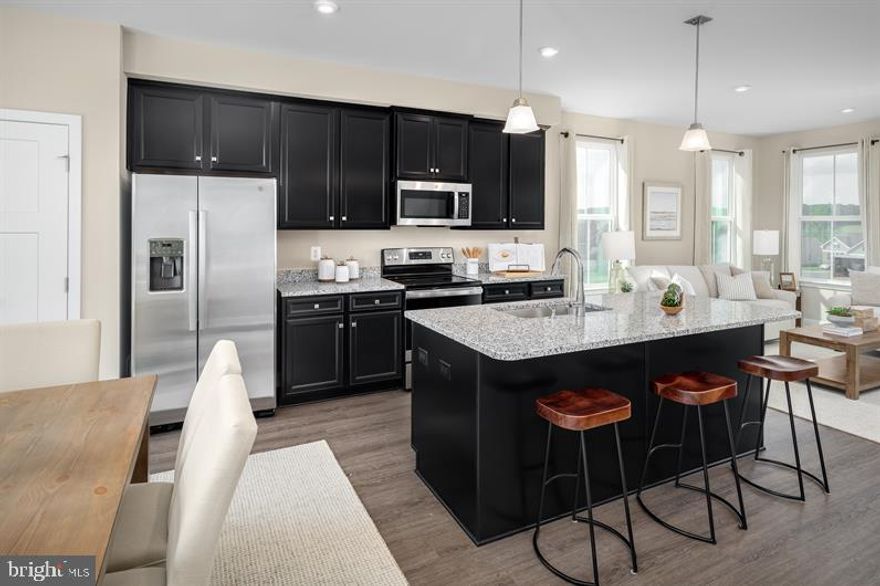 ***************ASK ABOUT CURRENT CLOSING COST ASSISTANCE********************
Welcome to Parkside Reserve! One of Anne Arundel County’s most sought-after new construction townhome communities offering luxury garage townhomes in an exclusive, amenity-filled, resort style community located in the heart of Hanover, MD. 
The To Be Built Aria offers the sort of space and natural light you’d expect from a single-family home into a gorgeous 1-car garage townhome. Enter through the ground floor foyer, which leads to a large recreation room or additional guest suite. On the main level, a wide-open concept invites you to gather with loved ones in the great room and enjoy delicious meals made in the gourmet kitchen with a large center island. The 3rd floor features two comfortable bedrooms and a full bath. Your luxury owner’s suite includes a walk-in closet and en-suite bath. Come see all there is to love about The Aria. All photos are representative only. Other homesites may be available. End of Group and wooded homesites are subject to a premium.
Parkside Reserve is conveniently located just minutes from I-295, Rte. 175 and Rt.32. This enables homebuyers to enjoy a convenient lifestyle close to everything. This makes it easy to get to the area’s employment centers, from major military bases to the Washington, DC, area. Plus, you are within 5 minutes of Hanover’s local amenities. Arundel Mills Shopping Center and Shops at Arundel Preserve are both nearby. Nearby stores range from Target to Home Depot. Restaurants include Lima’s, Southern Blues, and Pho One-O. Not only will you be upgrading where you live, but how you live. Come see why you will  love all that Parkside Reserve has to offer.