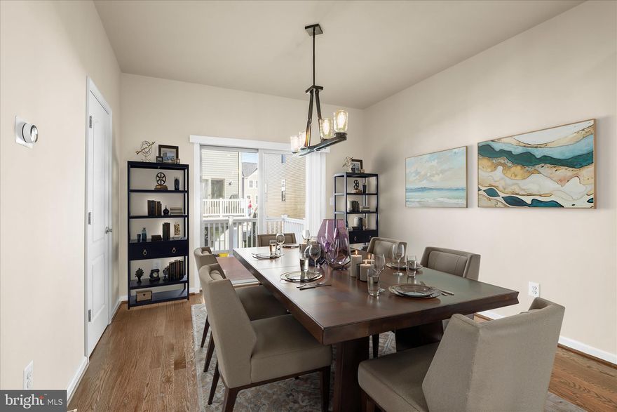 Discover this stunning end-unit Craftsman-style townhouse in the highly sought-after Tanyard Cove community of Glen Burnie. Showcasing a beautiful full stone front and fresh paint throughout, this home offers exceptional curb appeal and a bright, inviting atmosphere.

The entry level features brand-new carpet, newly polished floors, and a versatile bedroom or office with elegant French doors, along with a full bath and convenient access to a fully fenced backyard and patio—ideal for outdoor relaxation.

The main level boasts gorgeous hardwood floors, an abundance of natural light, and a cozy gas fireplace. The gourmet kitchen is a chef’s delight, complete with granite countertops, stainless steel appliances, a spacious center island, and access to an expansive deck—perfect for entertaining or unwinding.

Upstairs, the luxurious primary suite offers a private en-suite bath and generous closet space, plus an additional bedroom and full bathroom for family or guests.

Enjoy resort-style living with fantastic community amenities including a pool, clubhouse, dock, playground, and access to Solley Cove Park, all while being conveniently located near I-695 and MD-10 for easy commuting.