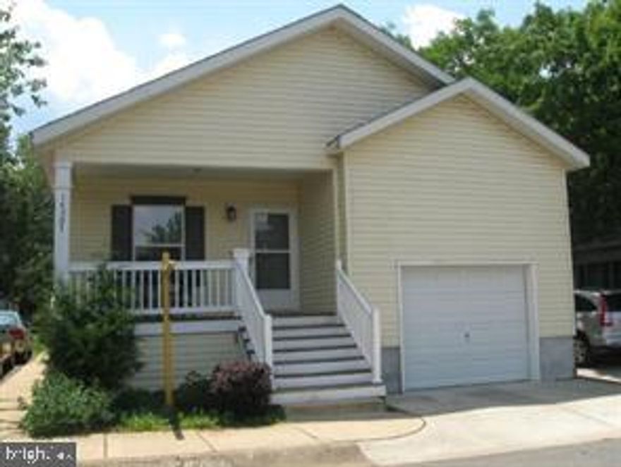 Gorgeous, updated home with a one car garage and a driveway with parking for 2 cars * Prime location in the front of the community, facing a grassy common area *  Ground rent is $1318/mo *  Front porch with ceiling fan * Newer luxury vinyl tile floors throughout 2015 * Updated kitchen with black appliances and updated two-tone cabinetry, with stylish copper tin panel backsplash  * Large living/dining combination * 2 Bedrooms and a den, easily converted to bedroom 3 *  Primary bedroom with private bath with step-in shower, updated cabinets and lighting  and custom walk in closet * Secondary bedroom with closet and ceiling fan * Hallway bath with updated cabinets and lighting * Third bedroom/den * Washer and dryer * Back covered porch *  Freshly painted with popular neutral colors throughout *  Newer flooring 2015 - Luxury Vinyl Tile and  tiled bathrooms * New HVAC 2018 -Lennox and Broan* New roof 2016- 30 yr arch shingle * FrontPoint security system (would need to activate with FrontPoint for monitoring service) * Keyless front door entry *  Ground rent is $1318.  Call for financing information.