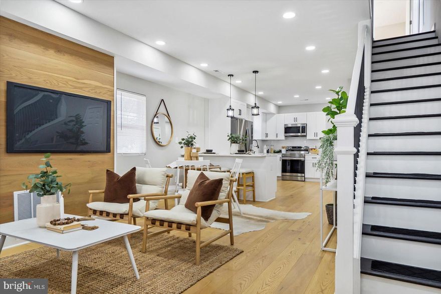 HIGHEST AND BEST OFFERS DUE 1/28 @ 5pm. Welcome Home! You will not be disappointed with this gorgeous open floor, 4 bedroom, 3.5 bath rehab by Division LLC. Home features includes a main level en suite with exterior access and generous closet space, engineered hardwood floors throughout, bright an airy kitchen with breakfast bar and quartz countertops, recessed lighting throughout, main level powder and laundry rooms, brand new appliances, gorgeous bathrooms with luxury tiling, a new deck with ample backyard space, an additional 2nd level ensuite and so much more! Home also has BRAND NEW HVAC, electric, mechanical systems and windows. Schedule your showing today.