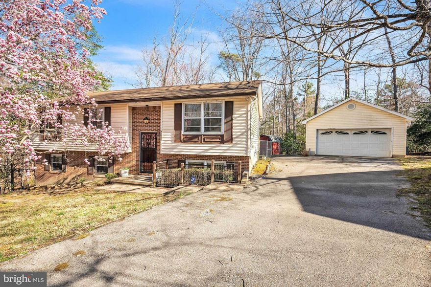 Single family home with 3 bedrooms (potential for a 4th!), 2 full baths, living room, and a kitchen with dining area. Large great room on the lower level with a fireplace.  Seller has remediated the entire home including carpet removal. Rear yard is fenced in and new rear steps to the kitchen door.  The 2 car garage has storage above and entire driveway is paved.  Selling AS-IS as it does need work and final finishes to make it your own. .