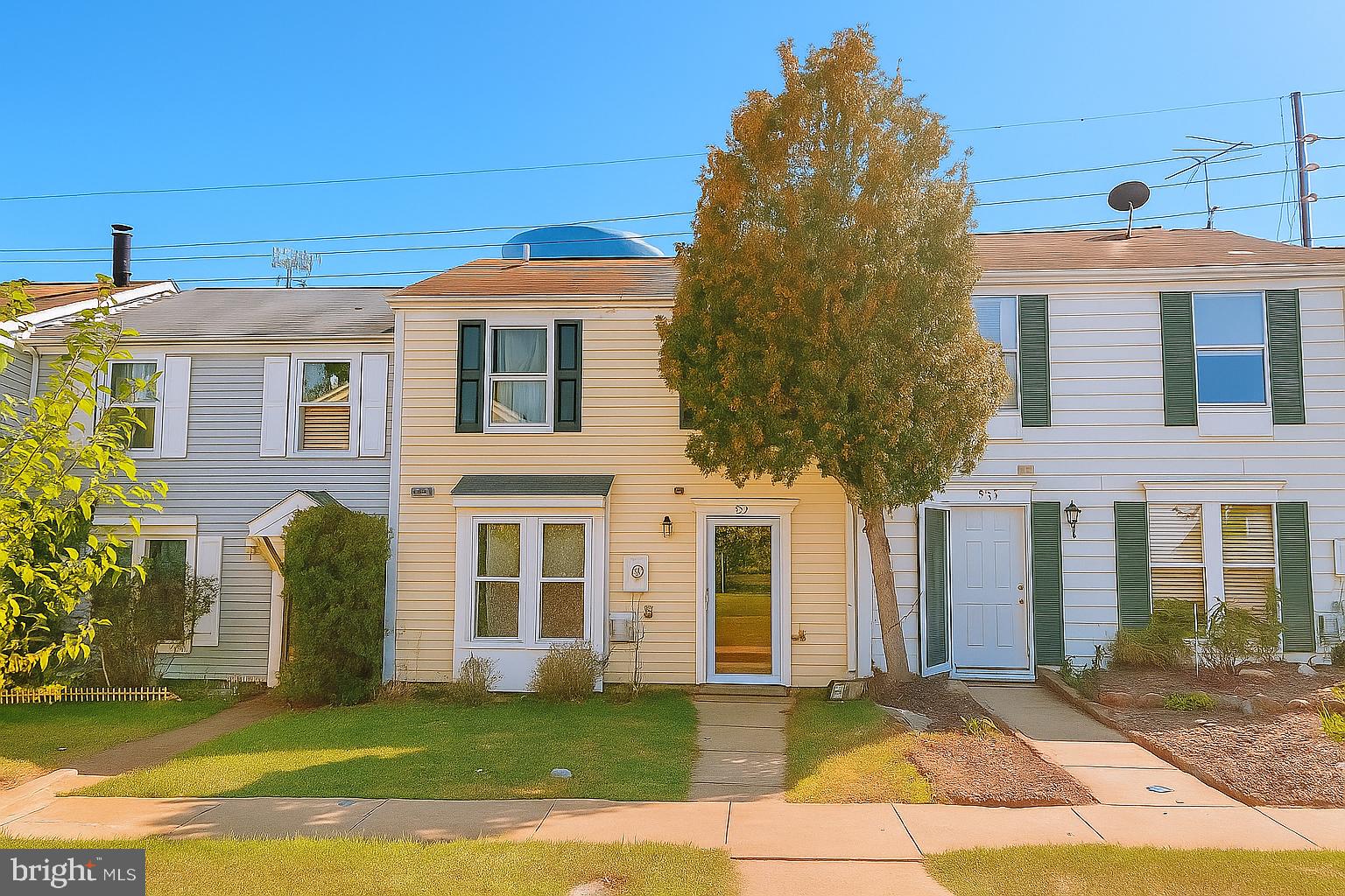 Welcome to this lovely 2-bedroom, 1.5-bath townhouse offering a bright and spacious layout with many thoughtful upgrades. The beautifully appointed kitchen features stainless steel appliances and flows seamlessly into the inviting living room, complete with a cozy fireplace. Upstairs, two comfortable bedrooms provide plenty of natural light and storage space. Step outside to enjoy a large fenced-in yard with a deck area, perfect for entertaining or relaxing. Conveniently located near shopping, dining, and transportation, this move-in ready home combines comfort, style, and convenience.