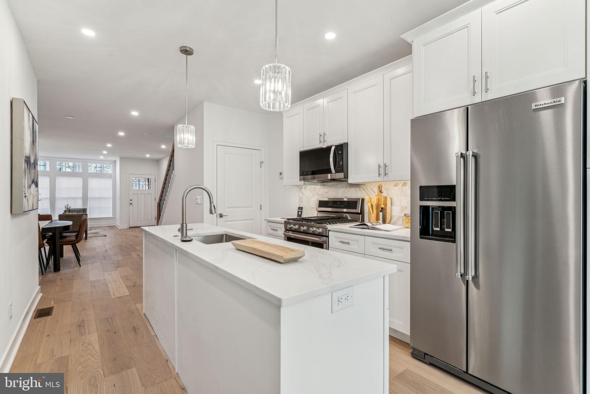Welcome to this exquisite fully renovated home in the highly sought-after Bella Vista neighborhood, where thoughtful design and attention to detail shine throughout. Boasting a one of a kind gorgeous brick façade, this architectural gem seamlessly blends classic charm with modern sophistication. Step inside to discover gleaming hardwood floors and an abundance of natural light streaming through expansive windows, creating a warm and inviting atmosphere. The heart of the home is the chef’s kitchen, featuring white shaker cabinets, a stylish tile backsplash, and a spacious island with additional storage. This home offers 4 generously sized bedrooms and 2.5 luxurious bathrooms, including a serene primary suite with a spa-like bathroom showcasing a large soaking tub—your private retreat after a long day. Ample closet space including custom shelving ensures plenty of storage throughout the home. The second level also has access to a large private deck. Adding to the appeal, the fully finished basement provides a versatile space ideal for a home office, media room, or gym. You will love the two private outdoor spaces, perfect for relaxation or entertaining. Pay special attention to the meticulously crafted woodwork found throughout the home—a rare and standout feature often missing in most other properties. The home also showcases architecturally stunning details, including elegantly curved walls, top-of-the-line windows, custom wood trim, and sophisticated railing systems, all adding to its timeless charm and refined craftsmanship. Nestled in one of Philadelphia’s most desirable neighborhoods, this home offers elegance, comfort, and convenience just steps from top dining, shopping, and entertainment options. Many of Philadelphia's best restaurants and popular destinations are a short walk from 614 Carpenter Street. Taxes and square footage is the responsibility of the buyer to have verified independently. Seller is working on the tax abatement.