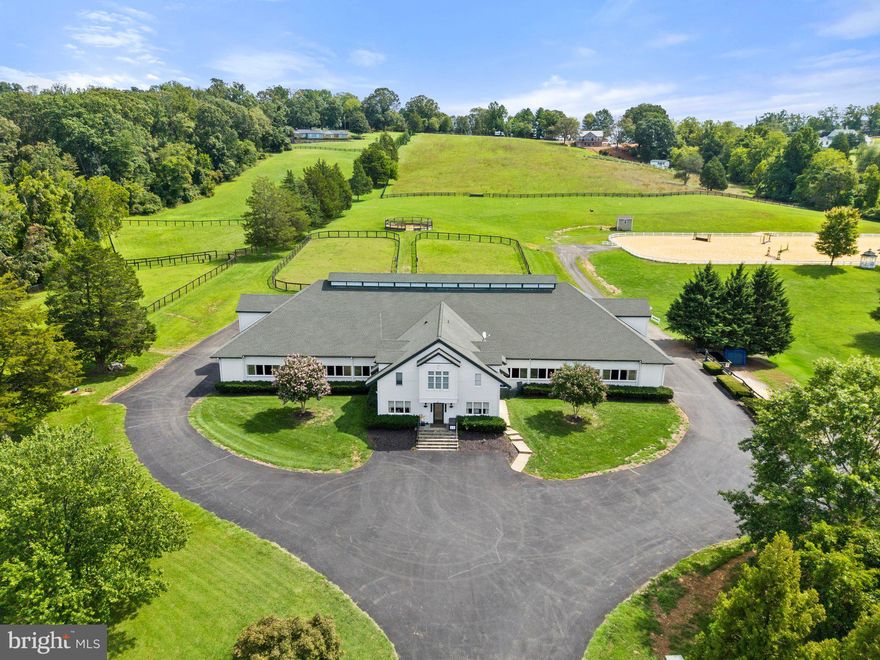 12 stall custom show barn, encircled by an enclosed shed-row to allow for exercising, with a history of great horses.  There are two heated wash/grooming stalls, 2 tack rooms share a heat pump, full loft with access to each stall, half bath, and storage closets.  There is an elegant office and large lounge arrangement with kitchen and half bath.  A two bedroom fully equipped apartment completes the barn.  There is a 150x280 show ring with new footing, a turn-out field that includes a spacious run-in shed with sliding doors for horses during inclement weather, five paddocks all with automatic waterers and a round training pen.  An invisible fence system for dogs. There is a fully enclosed, 3 bay garage/workshop with overhead gas heat (propane tank leased) and shed addition with air compressor.   Structure has 2 regular garage doors and 1 extra-large sliding door.  A bonus is a potential building site with mountain views to complete this offering.  1 mile from old town Warrenton.  Comcast.  The name EMO Stables LLC does not convey with sale.  Above ground gas, diesel tanks convey.  2 wells.  Stable roof shingles new in 2023.  All on 18 acres subject to completing boundary line adjustment.  Seller needs rent back.  in land use tax program. includes parcel 6973-97-4438.  Please no drive-ins.  Thank you.