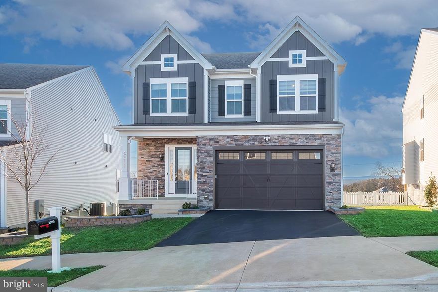 !!!NORTH EAST FACING SUN FILLED Rare opportunity to own a home in Poland Hills! built in 2021 by Stanley Martin featuring 5 BR, 4.5 Ba, 3 levels with upgrades galore! Entering the Foyer, you are greeted with crown molding, recessed lighting and an ample coat closet. A half bath is discreetly tucked in the entry. Impeccable hardwood floors draw you into the open concept main level, with 10-foot ceilings, recessed lighting and oversized windows that take in a green view. The chef's kitchen features sleek quartz counters, loads of storage in the upgraded cabinetry and an expansive island perfect to gather around. A large walk-in pantry provides even more space to store necessities. Just off the kitchen is a dining area with plenty of room to dine. The fireplace and mantel center take center stage in the living room. Just off the dining room is a covered deck overlooking the back yard which is fenced. A den space offers an ideal spot for an office or prayer room. Bringing groceries in from the 2-car garage is a breeze. Heading upstairs, you'll find a large flex space that connects to all 4 bedrooms. The Primary Bedroom suite is a true getaway, with a custom walk-in closet, vanity with ample storage and dual sinks, luxurious linen closet, a water closet and a custom shower featuring a bench and hand laid tile. There are 3 more bedrooms, each with custom closets and a spacious full bath with dual sinks on this level. The Walkout Basement provides a 5th bedroom with full size egress window and closet and a full bathroom. This has  Sprinkler System. A huge recreation room perfect for multiple uses walks out to the back yard, which is safely enclosed with vinyl fencing. Poland Hills is a sidewalk community on 53 acres of rolling green space that offers wonderful amenities, including walking trails, a Community Center with outdoor pool, and tot lots. Conveniently located near multiple shopping and dining options, golf courses, hospital, commuter lots, and park land.