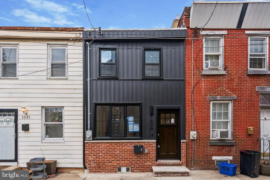 1,600 SQ FT of luxurious finished living space, 2-bed, 2-bath across, 3 floors including Finished Basement plus 300 SQ FT Outside Private Patio. Stunning Gut-Renovated Home, most sought-after part of Fishtown -Palmer Park! Ripped down to the Studs and Rebuilt. Completely transformed with top-to-bottom renovations, featuring brand-new: plumbing, electrical, new roof coating, New Exterior Facade, and sleek interior finishes. Every detail has been thoughtfully curated for modern living, boasting high-end fixtures, elegant flooring, and designer touches throughout. The open-concept layout on the first floor is bright and airy, with stunning custom millwork, high ceilings, and oversized windows that flood the space with natural light. The kitchen is a showstopper, featuring bespoke cabinetry, premium quartz countertops, state-of-the-art appliances. High End molding & trim work through all walls of the House. The primary suite features a Beautiful Accent Wall. Giving the main suite a serene retreat feeling, with vaulted ceiling. Step outside to your private backyard oasis, fenced and with a clean concrete Patio perfect for a BBQ Grill and outdoor furniture. Perfect for morning coffee, dining, or simply unwinding. Nestled next to a beautiful park, this home offers the best of urban living with a tranquil touch. Centrally located in prime Fishtown, you’re just steps from trendy cafes, award-winning restaurants, boutique shops, and vibrant nightlife. With easy access to public transit and major highways, commuting is a breeze. This home is truly a one-of-a-kind modern sanctuary—schedule your showing today before it’s gone!