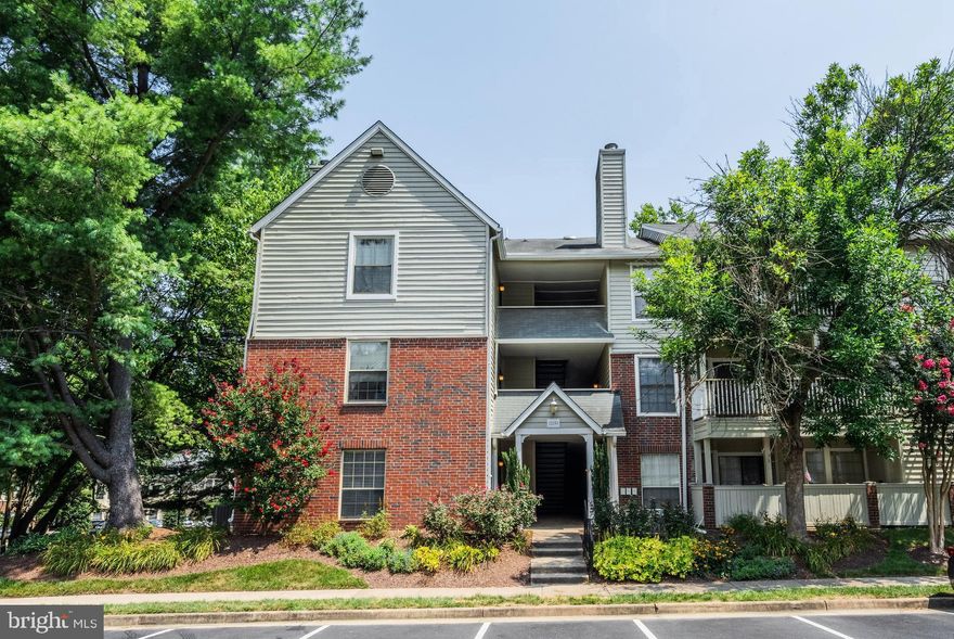 Welcome to the sought-after and amenity filled Penderbrook Square community. This move in ready, ground level one bedroom, one bath condo is a commuters dream  as well as a serene place to call home. The open floor plan, high ceilings, fireplace, laminate hardwood style flooring, and the covered patio  are just of a few of the standouts in this desirable property.   As you open the front door, the hardwoods welcome you into the foyer and flow throughout the main living area.  The entire home has been freshly painted with a natural color palette.  The living room offers a wood burning fireplace and has a niche with built-in shelving perfect for a home office space.   There is also a sliding glass door that opens to a large covered patio with a secure storage closet. The open kitchen is sure to please with Corian countertops, quality appliances, plenty of cabinet space and a pantry.  The peninsula provides bar style seating, perfect for casual meals.  The bedroom boasts high ceilings with a ceiling fan, New neutral carpet, a walk-in closet, and private access to the dual entry bath featuring a large vanity, mirrored accent wall, and a tub/shower.  A stacked washer and dryer add convenience and complete the comfort of this wonderful home. All this within an the desirable Penderbrook Community!!  The fantastic neighborhood amenities include a community center, outdoor pools, quarterly get togethers, a fitness center, basketball and tennis courts, jog/walking paths, playground, and a championship 18-hole golf course! Commuters will appreciate the easy access to I-66, Fairfax County Parkway and Route 50, the Metro bus stops in the community and bus to the Vienna Metro! Lots shopping, dining, and entertainment choices including Fair Oaks Mall, Fair Lakes, and Fairfax Corner.  This one surely won't last!