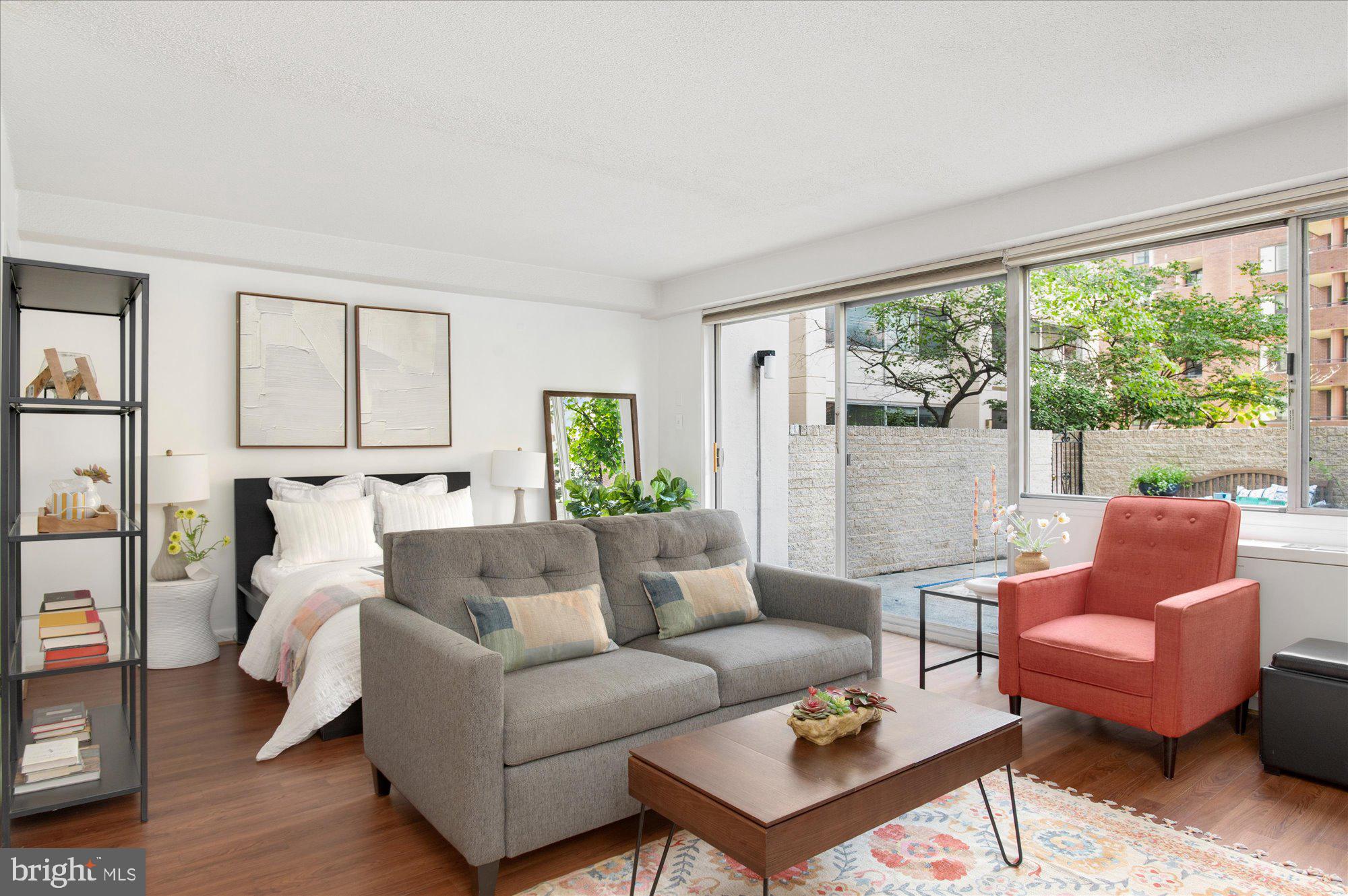 Open House SUN 2PM-4PM; Exceptionally rare opportunity to purchase a picture perfect studio with a 400 sq ft PRIVATE PATIO at the conveniently located and amenity-rich, Willoughby of Chevy Chase Condominium. Experience indoor/outdoor living at its finest with over 900 square feet of living and entertaining space. This charming unit boasts a flexible, open floorplan that can accommodate a king bed, a living area and a home office and still boasts a walk-in closet and generously sized and tastefully updated bathroom. The kitchen is framed by two archways, one of which sits atop a butcher block breakfast bar cutout that brings natural light into this cleverly configured space. A gas range and a combination of cabinets and modern, open shelving that provide excellent storage make this a home chef's dream. It also doesn't hurt that Whole Foods is right around the corner. You'll love that this unit walks out to a secure courtyard that sits right above street level so you never even have to get in the elevator to visit the fabulous restaurant and retail options that start right at your doorstep in Chevy Chase, Friendship Heights and in nearby Downtown Bethesda. Commuting is also a breeze with the Friendship Heights Metro just .3mi away.
The Willoughby at Chevy Chase is a full service building with a 24 hour front desk, a rooftop pool, a fitness center, a roof deck with stunning city and treed views, a library, several laundry rooms per floor and even a mini mart on its premises. Residents enjoy basic maintenance from the building engineer and staff and all utilities are included in the condo fee. Rental parking is also often readily available in the building and can be leased through the building or its residents.