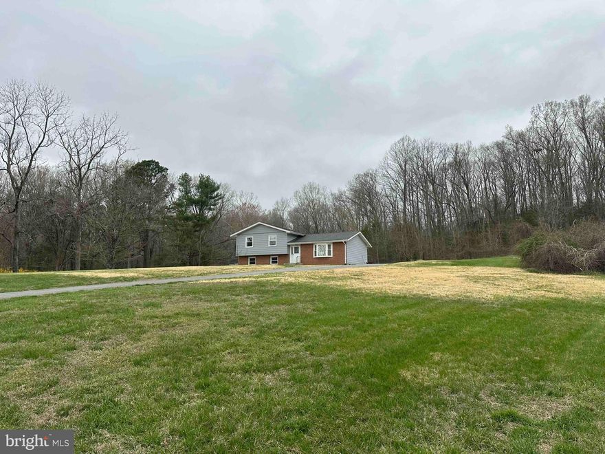 Opportunity awaits with this thoughtfully updated home situated on five acres in a peaceful, remote setting overlooking a lightly traveled road. The surrounding acreage has been cleared, offering flexible outdoor space for a variety of uses. Inside, the kitchen shines with new cabinetry, quartz countertops, recessed lighting, and all‑new appliances. Hardwood floors throughout the home have been professionally resurfaced and sealed with a fresh coat of polyurethane. Major system upgrades include a newly installed HVAC system providing central air, and a brand‑new water well scheduled for installation in the coming days. This property offers modern updates paired with expansive land and privacy.