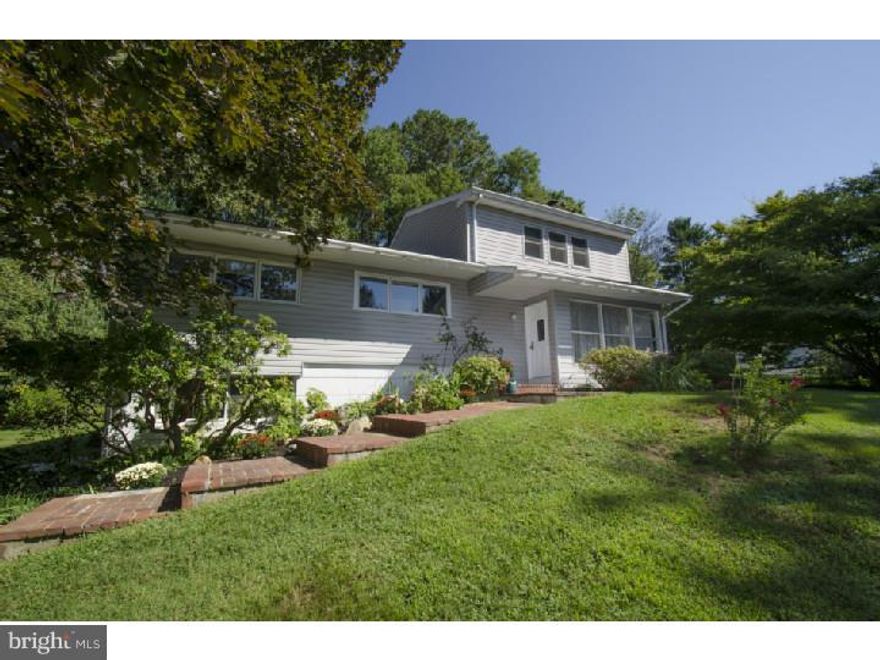Bright and cheery sun-filled home perched amongst the trees in the popular community of Riddlewood.  This 4/5 Bedrooms, 3 1/2 Bath home offers an open, airy floor plan and is much larger than most homes in this community as it was expanded 4' in width when it was constructed. The Bonus Room addition w/ cathedral ceiling and Bathroom is perfect for a large owner's Suite, Studio or Family Room. Upgrades include newer Kitchen (2006), updated Hall Bath (2014), newer roof (2009), heater (2013), h/w heater (2013) & newer washer and smooth top range/oven (2014).  Other features you will love about 65 War Trophy Lane are the gleaming hardwoods, fabulous secluded Deck w/awning and the long distance views over the tree tops. It's hard to believe this serene setting is only minutes from major highways (I-476, I-95 & Rte 1), Elwyn Train, hospital and downtown Media. Riddlewood has it own 3 acre community park, swim club (bond will transfer to new owner) and ball field and sponsors many community events such as egg hunts, yard sales and holiday celebrations!  What a great place to live!!!