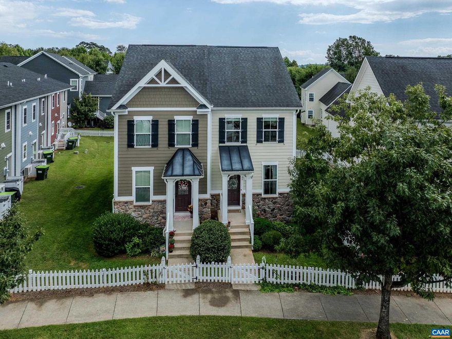 This light and bright duplex in Wickham Pond with a full basement is a rare find in Western Albemarle! With white picket fence and beautiful gardens and landscaping, this home looks like it's straight out of a fairytale. This light-filled home features an open main level floor plan with hardwood floors, two bedrooms on the second level plus a full basement that could be a great in-law or teen suite! The great room opens to the practical kitchen with white cabinets, island work surface and white appliances with stainless steel refrigerator. Upstairs, the primary bedroom features an ensuite bathroom with tub/shower combo, and two large closets. The second bedroom, full bathroom and stacked washer/dryer complete the second floor.  The lower level boasts a large rec room, third bedroom and accessible bathroom with zero-step shower. Two private parking spots at the rear of the home too!,White Cabinets