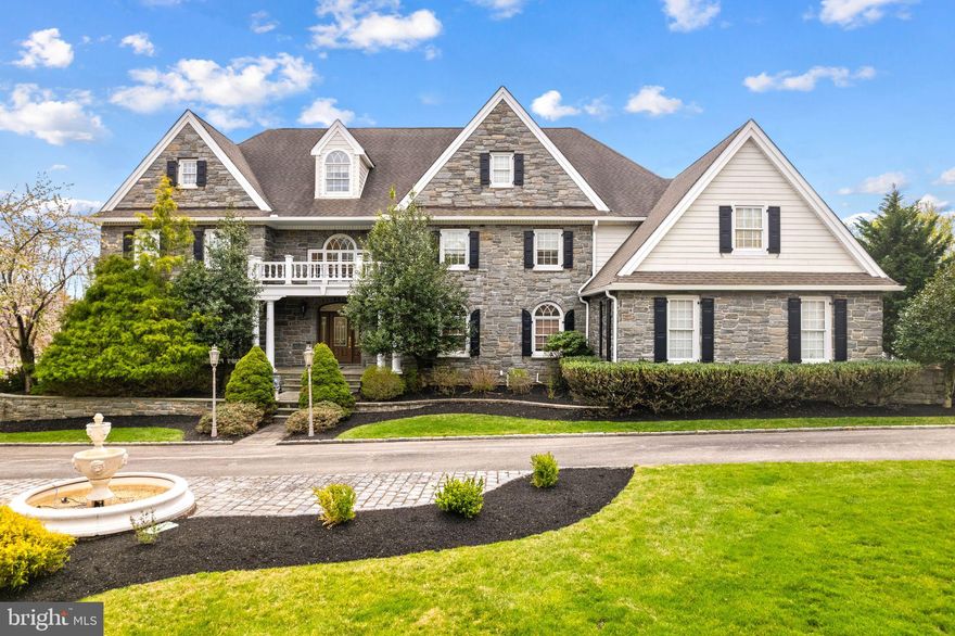 Welcome to 2 Greystone Circle, a stunning five-bedroom, six-and-a-half-bath estate nestled in the heart of Newtown Square. This exceptional residence harmoniously combines timeless architecture with exquisite craftsmanship, providing a peaceful sanctuary from the hustle and bustle of everyday life.

Constructed with rare full-width Mica stone—sourced from the same quarries used by the Archdiocese and esteemed universities—this home exemplifies superior quality. A charming Haddon Stone courtyard fountain, crafted in England, sets the tone for the refined aesthetics that define this property.

Spanning over 11,800 square feet, this estate is a showcase of artisanal excellence. Hand-carved Italian marble fireplaces, sculpted in China and installed by skilled Italian artisans, enhance the interior spaces. The ballroom and family room feature inviting wood-burning fireplaces, while other areas are equipped with gas logs. Marble columns and pedestals in the ballroom, adorned with classical figures symbolizing Poetry and Music, beautifully complement the stonework.

Solid-core interior doors with custom trim and Emtek hardware, paired with ¾” Brazilian Rosewood flooring, renowned for its durability and elegance, flow throughout the main living areas. The library, handcrafted on-site by Russian artisans using old-growth cherry, exudes sophistication. The kitchen is a culinary delight, featuring imported Lucchi cabinetry from Italy.

The second level is home to the luxurious primary bedroom suite, complete with an en-suite bathroom, alongside four generously sized bedrooms, each with its own bathroom and access to a full-size laundry room. The third level offers a tranquil retreat with a kitchenette, perfect for an extra bedroom, relaxation, additional workspace, or entertaining guests.

Step outside to discover a breathtaking inground pool that invites leisure and gatherings, all surrounded by the beauty of nature. The exterior boasts an expansive Ipe wood deck, celebrated for its durability and premium finish, making it an ideal space for entertaining or unwinding. This globally inspired estate, situated in one of the Main Line’s most sought-after communities, presents a rare opportunity. The extraordinary materials and artistry of this home must be experienced in person to be truly appreciated.