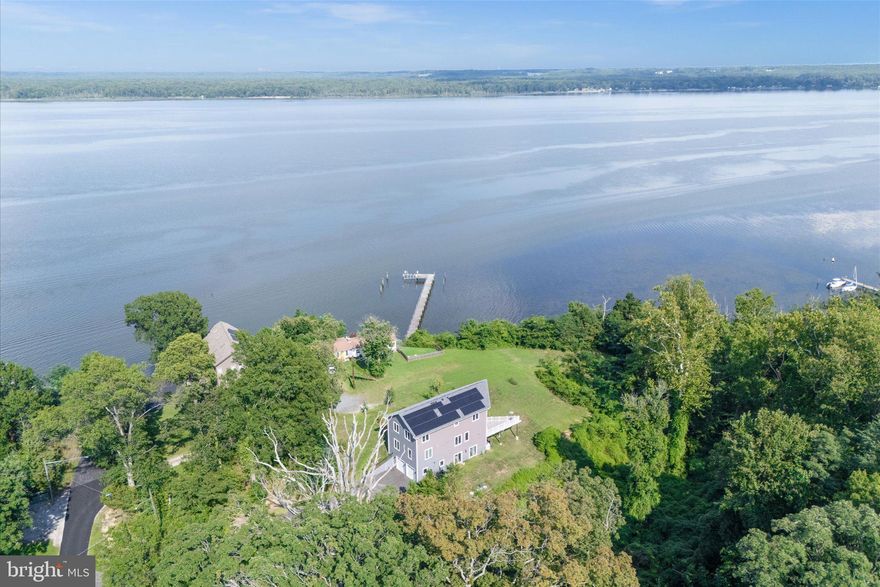 **OPEN HOUSE Sat, Dec 6 2:00 PM - 4:00 PM & Sun, Dec 7 2:00 PM - 4:00 PM**

For Sale or Rent (see MLS#  VAFX2277926).

An incredible opportunity to own breathtakingly gorgeous views of the Potomac River from this 5 Bedroom, 5 Bathroom home inspired by the river can't be missed! With over 6,130 Sq ft of space on .78 of an acre. The main level boasts a bright, open floor plan with beautiful hardwood floors throughout. With exceptional views of the Potomac River and large floor to ceiling windows, access to the deck, the first of two fireplaces, a gourmet kitchen with top of the line appliances, large island perfect for extra seating and a dedicated dining space. Finishing off the main level is one of the 5 bedrooms and a full bathroom. The lower level has the second fireplace, sliding glass doors to the backyard, another bedroom and full bath, and don't forget the wet bar with built-in wine cooler. Access to the electric vehicle ready 2 car garage is also available on the lower level. If you like the views on the main level, you'll love the views from the upper level primary bedroom!! More floor to ceiling windows overlooking the river with a large spa-like ensuite complete with separate shower and soaking tub and 3 closets! Two more bedrooms and full bathrooms complete the upper level. The solar panels reduce your carbon footprint, and your electric bill! Water Access to a beach area!