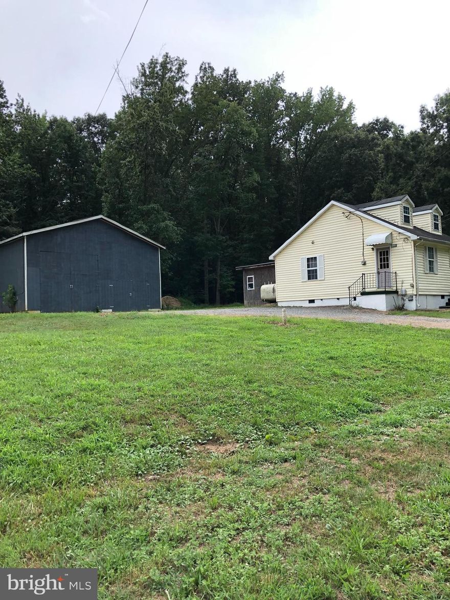 Cape Cod on 1/2 acre needs TLC and will be a great starter home or investment property. Sold As Is. Owner will finance with acceptable credit. The location is near LaPlata's hospital, government entities, shopping, and doctors' offices. Convenient commute to Prince Georges County and D.C.  The huge garage is perfect for an R.V., work trucks, boat, with multiple uses available. No HOA.  Home backs to woods. This property will not stay on the market long, call showing service for an appt.