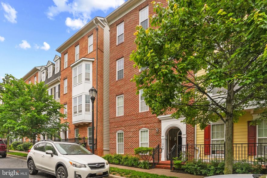 Back on Market, No Fault of Seller. Location, Lifestyle & Convenience - All in One Place! Welcome to 11249-2 Chase Street, a stunning, pristine move-in-ready three-level townhouse condominium located on a tranquil, tree-lined side street. Imagine opening your front door and being a mere 2 to 3 minutes from enjoying the community pool, gym, yoga studio, outdoor sporting facilities, year-round events and so much more! This home features a private in-home elevator and is thoughtfully designed for effortless living in the heart of the Maple Lawn community in Fulton, Maryland. Built by Bozzuto, this home offers the perfect balance of timeless elegance and thoughtful upgrades featuring gleaming hardwood floors, high ceilings, and crown molding throughout. The open-concept main level is bathed in natural light and elevated by recessed dimmable lighting in nearly every room, creating a warm and inviting atmosphere. At the heart of the home, the chef’s kitchen showcases stainless steel appliances, granite countertops, a large butler’s pantry and a dry bar. The kitchen island is fully tiled, adding a sophisticated, designer touch, while ceiling-height cabinets all with under-cabinet lighting enhance both style and storage. Whether hosting a dinner party or enjoying a quiet meal, this space is as functional as it is stunning. The adjacent family room features a cozy gas fireplace and opens to a private balcony perfect for relaxing with a morning coffee or evening drink. A dedicated office with elegant French doors offers a quiet space for work or study. Ascend to the upper level, the primary suite is a serene escape, complete with rich hardwood flooring, a large walk-in closet, and a spa-like suite bath with a soaking tub and separate shower. Two additional generously sized bedrooms, each filled with natural light with oversized closets that share a full, well-appointed bath. The laundry room is conveniently located on bedroom level for ease and efficiency. Additional conveniences include a garage and easy access to boutique shopping, gourmet dining, and scenic green spaces, all throughout the community. With its prime location on Chase Street, luxurious features, and exceptional design, this Maple Lawn gem offers a lifestyle of comfort, style, and accessibility. Don’t miss the opportunity to make it yours!