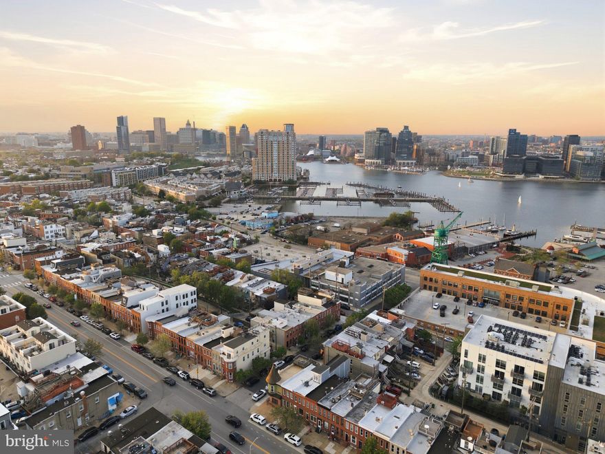 You already love this neighborhood. Now imagine owning it. 1452 Boyle St sits in the heart of Riverside, nestled between the waterfront and the charm of Riverside, one of Baltimore City's most established, tight-knit communities, where neighbors have been planting roots for decades and have no plans to leave. This is the kind of street where people know each other's names, take pride in their block, and show up for one another. Homes here don't come available often, and when they do, they don't last.

Inside, everything has already been done for you. Brand new flooring flows throughout every room, a new cooktop anchors a kitchen that's ready for real cooking, and three full bathrooms mean mornings actually run smoothly. The three bedrooms are generous and well-proportioned, the condition is spotless, and the layout simply works. Move-in ready isn't a marketing phrase here, it's the literal truth.
And then there's the rooftop. Step up to your own private sky above the city, morning coffee as the neighborhood wakes up, golden hour drinks with friends, open air and sweeping views over the water that remind you exactly why you chose this corner of Baltimore. Add two-car parking, a genuine rarity in this part of the city, and this home offers something most listings around here simply can't match.

The community surrounding it only adds to the appeal. The Giant is right across the street, so errands take minutes, not trips. Francis Scott Key Elementary and The Goddard School of Locust Point are both nearby, and for families looking to put down real roots in the city, this neighborhood genuinely delivers. Tree-lined streets, well-kept homes, waterfront access just steps away, and a community where kids grow up knowing their neighbors. It's the kind of place that makes raising a family in Baltimore not just possible, but something you'd choose all over again. Fort McHenry and some of Baltimore's most beloved restaurants and bars round out a lifestyle that's hard to replicate anywhere else in the city.

This is a community where people arrive and decide to stay, for years, often for life. The pride of ownership on this block shows in every well-kept home and every neighbor who waves as you walk by. That's not something you find everywhere, and it's exactly what makes this stretch of South Baltimore one of the city's most sought-after addresses. All furniture, including smaller items, is available for purchase. Whether you're moving in this weekend or setting up a premium rental, this home can be completely ready from day one. No sourcing, no staging, no waiting. Homes like this don't sit. Schedule your showing today, your Riverside chapter starts here.