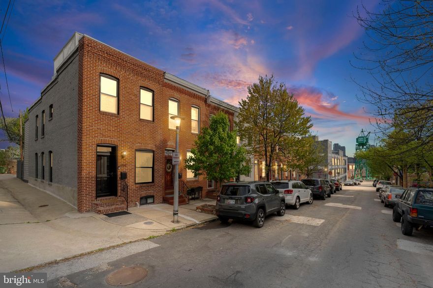 You already love this neighborhood. Now imagine owning it. 1452 Boyle St sits in the heart of Riverside, nestled between the waterfront and the charm of Riverside, one of Baltimore City's most established, tight-knit communities, where neighbors have been planting roots for decades and have no plans to leave. This is the kind of street where people know each other's names, take pride in their block, and show up for one another. Homes here don't come available often, and when they do, they don't last.

Inside, everything has already been done for you. Brand new flooring flows throughout every room, a new cooktop anchors a kitchen that's ready for real cooking, and three full bathrooms mean mornings actually run smoothly. The three bedrooms are generous and well-proportioned, the condition is spotless, and the layout simply works. Move-in ready isn't a marketing phrase here, it's the literal truth.
And then there's the rooftop. Step up to your own private sky above the city, morning coffee as the neighborhood wakes up, golden hour drinks with friends, open air and sweeping views over the water that remind you exactly why you chose this corner of Baltimore. Add two-car parking, a genuine rarity in this part of the city, and this home offers something most listings around here simply can't match.

The community surrounding it only adds to the appeal. The Giant is right across the street, so errands take minutes, not trips. Francis Scott Key Elementary and The Goddard School of Locust Point are both nearby, and for families looking to put down real roots in the city, this neighborhood genuinely delivers. Tree-lined streets, well-kept homes, waterfront access just steps away, and a community where kids grow up knowing their neighbors. It's the kind of place that makes raising a family in Baltimore not just possible, but something you'd choose all over again. Fort McHenry and some of Baltimore's most beloved restaurants and bars round out a lifestyle that's hard to replicate anywhere else in the city.

This is a community where people arrive and decide to stay, for years, often for life. The pride of ownership on this block shows in every well-kept home and every neighbor who waves as you walk by. That's not something you find everywhere, and it's exactly what makes this stretch of South Baltimore one of the city's most sought-after addresses. All furniture, including smaller items, is available for purchase. Whether you're moving in this weekend or setting up a premium rental, this home can be completely ready from day one. No sourcing, no staging, no waiting. Homes like this don't sit. Schedule your showing today, your Riverside chapter starts here.