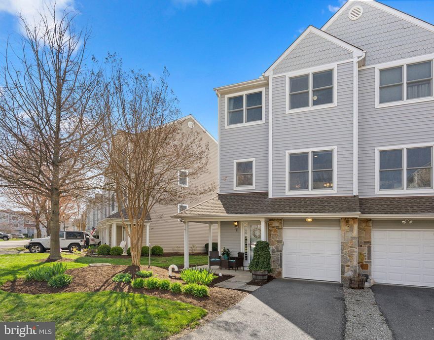 Welcome home to this beautiful garage townhome in the sought-after Bayside Community! Spacious open concept end unit offering 3 bedrooms, 2 1/2 baths,  newly renovated kitchen, fresh designer neutral paint  throughout, vaulted ceilings, hardwood floors & gas fireplace. Sit on the deck or patio and enjoy pond views. Amazing community amenities: gym, pool, and tennis court & club house.  Walking distance to great restaurants and marina!  Close to the bridge for easy commuter access. Schedule your private tour today!