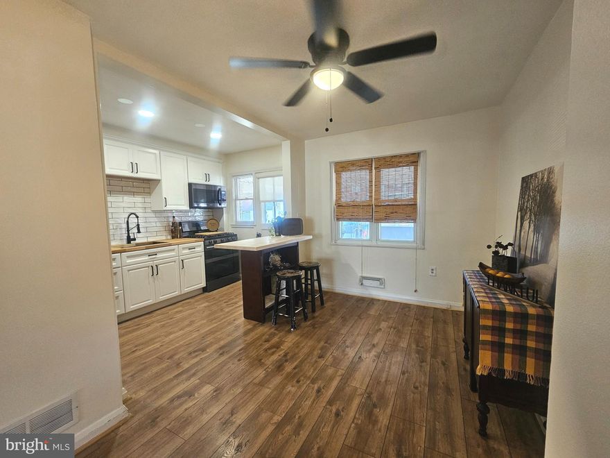 **Seller is ready to A$$I$T buyer (with the right offer) to make this their new HOME!!**Home was recently appraised for well over asking price.  OPEN HOUSE 10/24: 12:30 TO 3 P.M.***Welcome to 1940 Wareham Road in Dundalk where modern comfort meets classic appeal.  The home is newly renovated, but still offers opportunity to build equity.  Move right in to this modern and updated brick rowhome with open concept main level living.  Upon entry, you are greeted by an enclosed front porch that was recently taken down to the studs and redone.  Continue in the main door and you are greeted with a neutral new LVP that runs throughout the main level, as well as this level being freshly painted.  The kitchen, open to the dining space, features white soft-close cabinetry, white porcelain subway tile, deep stainless steel sink, new fixtures and butcher block countertop.  New Samsung appliances: Refrigerator is a French door fingerprint resistant stainless steel, stove is gas cooking with 5 burners, oven below and microwave mounted over stove.  There is a butcher block center island, that is not permanently fixed, between the kitchen and DR. Home has vinyl replacement windows throughout.  Before checking out the upstairs, step out on to the LARGE covered back deck.  This is opportunity #1 for building some equity.  Convert this space into a 4-season room for a man-cave, movie theater, larger dining space or space for the girls (craft room, book club, wine night – you name it)!  Make it 4 season living space and add to your square footage = instant equity.  Up to the top level and you will find the SPACIOUS owner’s BR  with a modest custom closet with cubby space and ample room to hang clothing.  The 2nd BR and full bathroom are also on this level. Both BRs have hardwood flooring that could be updated, equity option #2 -- either refinish them or update with LVP flooring.  Down to the lower level and you have your 3rd BR option, OR an additional family room.  This space has been recently refinished with new sheetrock and freshly painted.  There is a flush off this room.  Equity option #3 -- finish off this space with a full bathroom. The laundry room on this level offers a large folding table.  There is also access to the outside. Home features a newer architectural shingle roof, also on the enclosed front porch and over the back deck. For those outdoor enthusiasts, this home is 1 mile to Merritt Point Park that features a pubic boat ramp, pavilion, picnic tables, playgrounds and loads of shoreline to fish from.  Home is also within walking distance to Stansbury Park with walking trails and a fishing pier. The home features a large walk-in storage shed in the backyard to store all your outdoor toys.  The storage shed sits on top of the parking space.  Home is close in proximity to 695 for easy commutes to Towson AND also close to Eastern Avenue for a short commute to downtown/Inner Harbor, Ravens or O’s games.  Home is also close to CCBC campus – so close you could walk.  About a 9 minute drive to Sparrows Point Country Club. The butcher block island is a staging item and is EXCLUDED. All other staging items excluded.