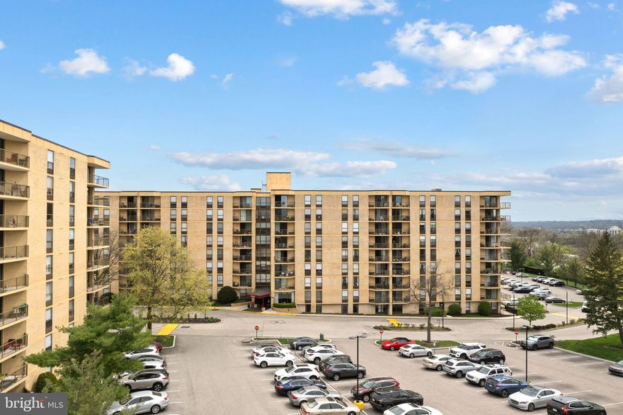 Experience the pinnacle of refined living within the prestigious Plymouth Hills enclave. This impeccably curated fifth-floor residence harmonizes modern sophistication with the comforts of home, offering an expansive two-bedroom layout designed for both high-end entertaining and quiet sanctuary. The interior is defined by gleaming hardwood floors and an open-concept living area, where floor-to-ceiling glass sliders reveal sweeping, verdant views of the surrounding landscape. A gourmet kitchen serves as the home’s culinary heart, featuring custom 42-inch cabinetry, lustrous granite surfaces, and a suite of premium stainless steel appliances. The primary suite is a true retreat, boasting an oversized dressing area and a private en-suite bath. From the convenience of in-unit laundry to the peace of mind provided by gated security, every detail has been considered. Beyond your door, indulge in a five-star amenity suite including a private pool, tennis courts, and elegant social lounges. Schedule your private tour and see everything this wonderful property has to offer.