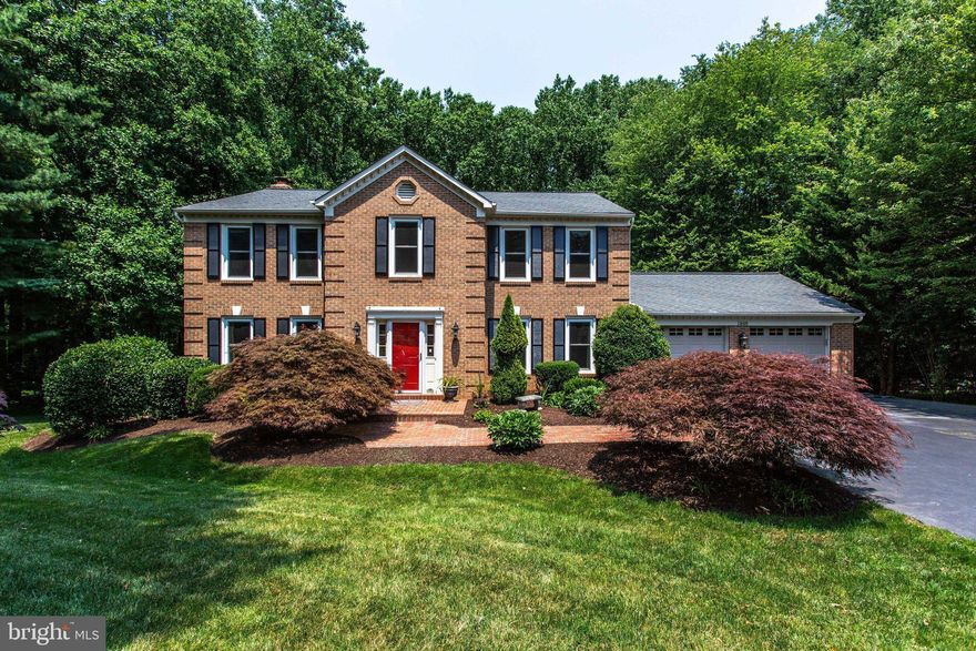 Fantastic opportunity for this meticulously cared for home with many improvements and updates.  This move-in ready Colonial is sited on 0.88 acres on a quiet street and in the friendly neighborhood of Amber Woods with amenities including tennis courts, playground and park area.  The 5 bedrooms, 3 1/2-bath home boasts gleaming hardwood floors on the main level and upper level, and beautifully remodeled kitchen.   Fully finished, walk-out lower level has been recently remodeled with new flooring, home theatre and huge wet bar.   The large, flat, private yard backing to parkland, provides a large deck for relaxing and alfresco dining.