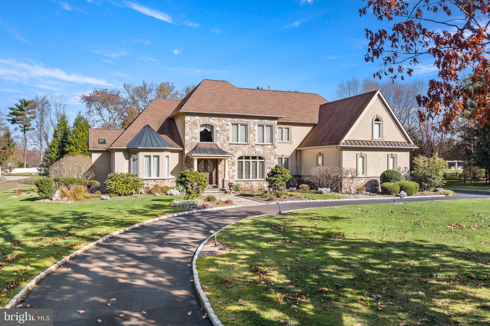 One of Lower Gwynedd's finest. Custom Built Guidi Home with master suite on the first floor. Welcome to 1013 Gypsy Hill Rd impressive circular drive and stone front with expensive double wood doors and on over an acre of beautiful land.
This spectacular home has a multitude of upgrades from the Gourmet Kitchen to the Heated Garage floors.
This sparkling kitchen is sure to delight any cook and host. An oversize island with its granite countertop is a crowd pleaser. This custom designed kitchen boasts of granite tops, perfect backsplash, double oven and many cabinets. Lighting in the kitchen, as throughout the house, is upgraded with designer chandeliers and hanging light fixtures. A stunning grand circular staircase and beautiful hardwood floors welcomes you as you enter. The formal dining room features custom made built in and convenient access to the kitchen, The dramatic Great Room is enhanced with a gas fireplace, large windows and adjacent to the bar/entertainment area. The main bedroom with has three hugh closets and a divine bathroom with soaking tub, heated floor and his & her vanities. The second-floor houses two more bedrooms and two bathrooms, plus it features a walk-in closet. A fourth bedroom is studded out and has a window it just needs a doorway from the second- floor hallway. The fourth bedroom would be over the bar area. Exterior backyard is great for entertaining on the stone patio and fenced in large yard. Heating and air conditioning has 3 zones for your comfort. Home Warranty Included. This home is not your usual colonial home and is immaculate. Close to all major roads, restaurants and shopping. Agent is related to the seller.