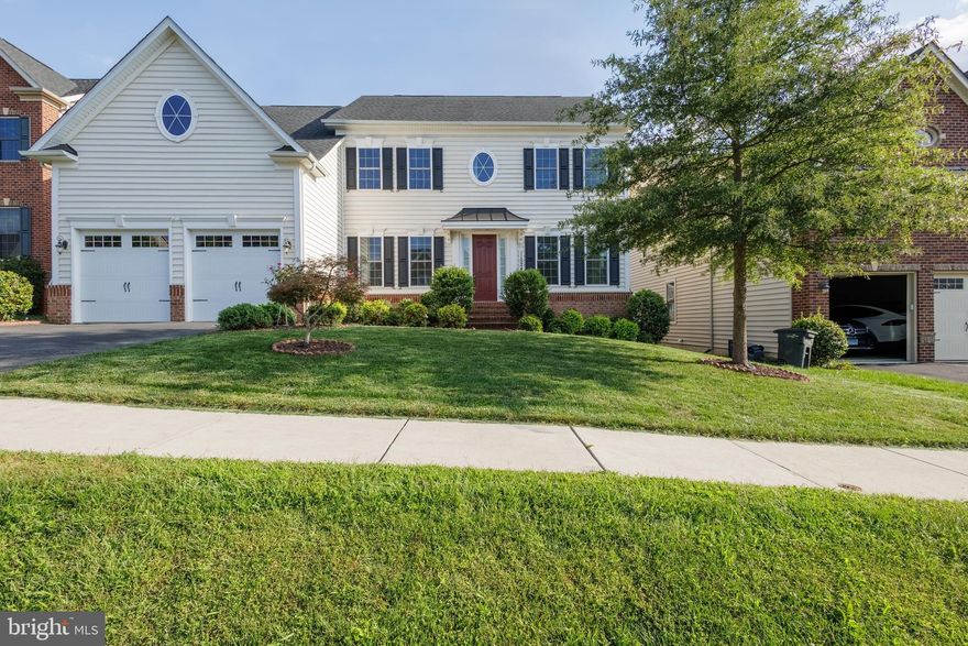 Refined Living in Clarksburg Village. Surround yourself in classic elegance in this stunning 6500+ sq ft. home, built in 2017 and loaded with most available options. This gorgeous five bedroom home features a dramatic and open two story family room with a coffered ceiling and gallery overlook. The expansive chef’s gourmet kitchen includes an oversized island with granite countertops, double sink, cooktop, built-in microwave, double wall oven, 42” raised panel cabinets, a butler’s pantry, and a banquet size dining area. The main level foyer opens to the study and formal dining room, paneled in chair-rail height wainscoting. The large private study set off by double glass doors boasts beautiful natural light where it is nicely tucked away providing added privacy yet easy accessibility to family activities. The main level also incorporates a first-floor suite with full bath and walk-in closet for hosting friends and family. Gleaming hardwood floors and 10 foot ceilings grace the main level. An arrival center off the extended 2-car garage offers convenience. Upstairs the amenities continue with spacious bedrooms, a linen closet, and a coveted second floor laundry room. Using the dual staircases to access the upper level, you will find a lavish primary suite with huge walk-in closets, a tray ceiling, a separate sitting room, and your own private balcony. You will love the luxurious primary bathroom with a soaking tub, ceramic tile shower and separate comfort height double vanities. The upper-level also includes an upgraded Jack-n-Jill bathroom between bedroom 2 and 3 with dual sinks and large closets. Bedroom 4 has its own upgraded ensuite bathroom and walk-in closet as well. Designed for comfort and efficiency, the residence features 4 separate HVAC zones. The lower level offers exceptional versatility, featuring an expansive recreational room with luxury vinyl plank flooring throughout and custom 6 inch baseboards. Step through the double French doors to a level walk-out and a private fully fenced backyard. Additional features include custom landscape lighting in front and a raised planting bed. Located in Montgomery County just minutes from Exit 16 on I-270, Kentlands, and Washingtonian Center.