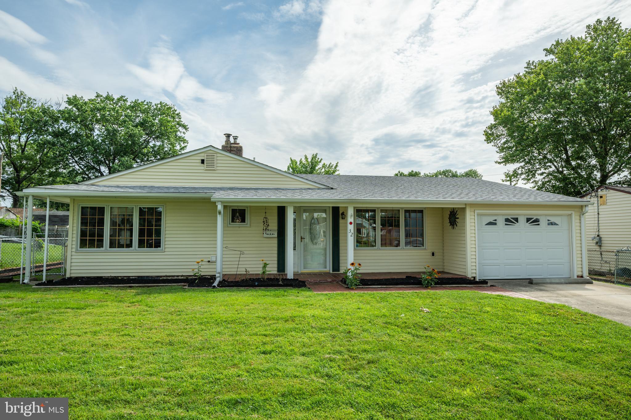Welcome home to this charming 3 bedroom + office home in Levittown! Boasting thoughtful updates and versatile living space, this home offers the perfect blend of comfort with modern convenience. Manicured landscaping guides you to the welcoming front entry. Step inside to your open foyer where a dedicated laundry room with convenient built-in shelving sits to your left. Take a few steps further to your spacious and sun-filled living room featuring fireplace and direct access to your side yard. Continue to your expanded eat-in kitchen boasting an updated electric cooktop, generous counter space and ample cabinetry for all your storage needs. Your kitchen flows seamlessly to your dining room featuring direct access to your backyard patio, perfect for indoor/outdoor entertainment! Off the kitchen, an additional room offers versatility and can be used as a family room, office or 4th bedroom and comes complete with private access to your backyard! Continue towards the back of the house, past an updated powder room and full hallway bathroom complete with a tiled tub/shower combo to three spacious bedrooms, all with windows for natural light. Step outside to your fenced-in backyard retreat lined with flower beds, featuring a patio to enjoy your morning coffee or entertain for social gatherings and open space ideal for games and activities. This home offers an attached garage with pull down stair access to the attic for added storage! Other upgrades include 3 mini-split systems for customized climate control, newer refrigerator, updated windows, updated siding, NEW roof (2021) and French drain system! Located close to a variety of shopping and restaurants and near I 295, the PA Turnpike and Levittown Station with service to Center city for easy commuting. Don’t miss your opportunity to see this beautiful home!