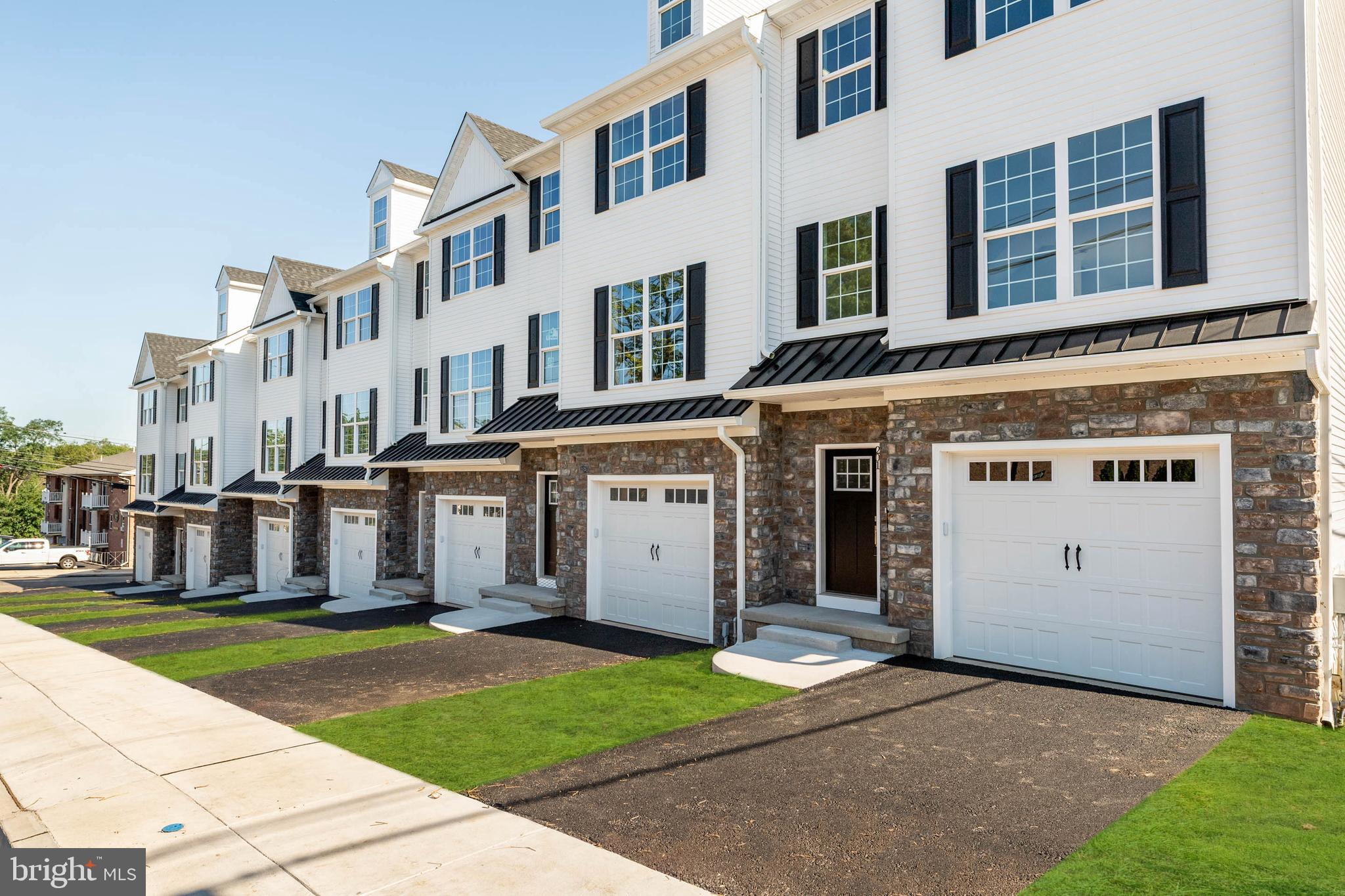 Discover the perfect blend of modern style and practical design in these brand-new construction townhomes at Bridgeview Crossing. Featuring 7 exclusive residences, choose from spacious 3- and 4-bedroom models with 2.5 bathrooms and over three levels of thoughtfully designed living space. Step inside the home from the covered front porch to the entryway with coat closet. The main level features an open concept layout with 9-foot ceilings, luxury vinyl flooring, and plenty of natural light. Throughout the home, recessed lighting enhances the bright, modern feel. A convenient powder room and pantry add functionality to this stylish space. The gourmet kitchen serves as the heart of the home, showcasing a stunning 8 foot island, 42 inch cabinets, quartz countertops, and a suite of GE stainless steel appliances. Seamless flow from the kitchen to your private Trex deck makes entertaining easy. Upstairs, retreat to your primary suite, complete with a walk-in closet and a spa inspired bathroom featuring dual vanities, tile flooring, and a walk-in shower with a semi-frameless glass shower door. The second bedroom is spacious with ample closet space, while the hall bathroom, linen closet, and convenient laundry area add to everyday ease. All bedrooms are wired for ceiling fans to provide added comfort and flexibility. The top floor offers a third bedroom, perfect as a guest space, home office, or private retreat, complete with a deep storage closet for versatility. The finished lower level expands your living space and opens to a second Trex deck, ideal for outdoor gatherings. Inside, enjoy direct access to your 1-car garage, wired and ready for your EV charger, with additional storage space. A private driveway provides added convenience. Located in the highly regarded Upper Merion School District, and just minutes from King of Prussia, Conshohocken, major commuter routes, shopping, dining, and recreation, Bridgeview Crossing delivers ample space, modern luxury, and a truly convenient lifestyle – all with no HOA fees. Schedule your private tour today!
