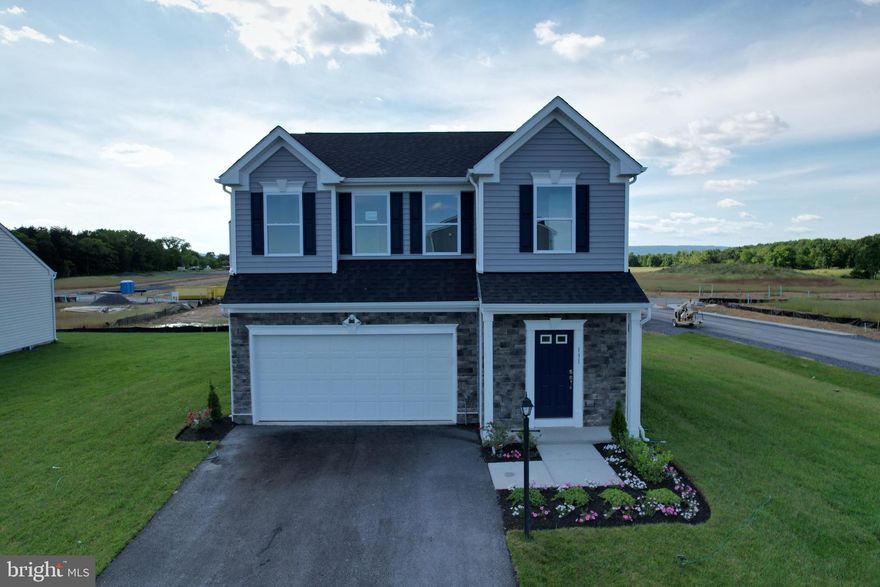 Ready for a July move-in! This traditional 1,845-square-foot home boasts 3 bedrooms and 2 bathrooms. As you step inside, you'll find a convenient powder room bath and a 2-car garage to your right. The welcoming entrance hallway leads to a spacious family room and kitchen, perfect for hosting dinner parties with its open-concept layout. On the far right, you'll discover a bright and airy breakfast nook opposite a large kitchen island counter.
Upstairs are three large bedrooms and two full baths. The highlight is the owner's suite, complete with a generous walk-in closet, dual vanity, and walk-in shower. Another walk-in closet is featured in the second bedroom, while the second and third bedrooms share a dual vanity bathroom.
CALL FOR TOUR. HOME CURRENTLY UNDER CONSTRUCTION. PHOTOS OF SIMILAR MODEL. Don't miss this opportunity! Home currently in construction - photos for representation only. Schedule your tour today!