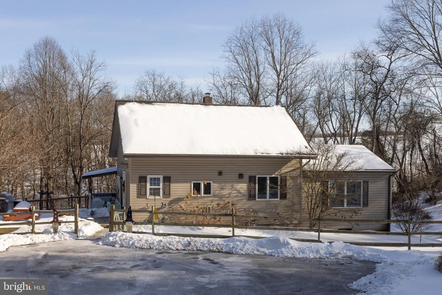 Enjoy the privacy and space of this unique 3BR/2BA contemporary home in Parkton set on 4.7 wooded acres with total seclusion, a cabin tucked in the woods and a stream. The main level offers LVP flooring, a welcoming foyer/study area. The kitchen has GE Café stainless appliances, granite countertops, and an island with breakfast bar, plus a large dining room with a balcony overlooking the rear yard. Step into the spacious living room with cathedral ceilings and exposed beams. Also on the main level you will find a main-level bedroom and full bath with tile flooring and a shower stall. Original hardwood flooring remains under the LVP in the foyer, kitchen, dining room, and bedroom. Upstairs, the primary suite features hardwood floors, built-ins, room for a sitting/dressing area, and a private bath with additional built-ins, double-sink vanity, and tub/shower. The lower level includes a rec room, third bedroom, utility/storage room, and an additional flex space ideal for a game room, gym, or extra storage. The basement laundry room has a walk-in shower and may be converted into a potential third full bath. Also, enjoy time on the large deck with a bar perfect for grilling and entertaining. Convenient to I-83 while tucked away near Pretty Boy Reservoir and Gunpowder River & Park.