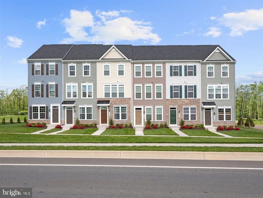 Clarendon model at Elkridge Crossing- Featuring the 4 finished levels and a deck off of the kitchen. Never has convenient townhome living felt as luxurious as it does in the Clarendon; and with so many customizing options, it's sure to fit your needs. The lower lever features a 2 car tandem garage, perfect for parking or whatever you need to store. On the main level and you'll find yourself in a welcoming and light-filled open floorplan, more spacious than you thought possible in a townhome. A gourmet kitchen creates a sense of warmth and unity, while the dining room gives a perfect place for entertaining. A huge family room can be furnished in the way that suits you best; while a large coat closet and powder room are tucked away but convenient for guests. Don't forget to add the optional deck and bring outdoor living to your home. Upstairs the feeling of space continues with a large hall foyer. The primary bedroom is an oasis and features a large shower, dual vanity, and gigantic walk-in closet. A second bedroom also features its own bath.  The 4th floor includes a 3rd bedroom, full bath and a loft. The fourth level includes a 3rd bedroom, loft area and bath.  There are optional designs to customize this 4th level for your lifestyle. Options vary by community, so you can be sure to have the home that's right for you!  There are many places you can choose to build your new home. Why here? Why Elkridge Crossing?  When you move to Elkridge Crossing, you're not only becoming a part of an amazing new neighborhood but you get to enjoy all the perks of living in Howard County!  Top Rated Schools. You'll love the peace of mind knowing that your children are going to some of the area's best schools. Use the community walking trail for easy access to both Elkridge Elementary and Elkridge Landing Middle School and drive a few minutes down the road to Howard High School.  Convenience. No matter where you work, your commute just got easier! Located off route 1, you'll have easy access to route 100, I-95, I-295, I-895 and more. With shopping and dining also close by, your life becomes less chaotic having all of your everyday conveniences within close reach.  Family Fun. There are so many options available all located within minutes of our community. Head to Patapsco State Park where you can bike, hike, fish or camp. Rockburn Branch Park is also a great choice and offers miles of scenic trails, athletic fields, playgrounds, a disc golf course and a picnic pavilion!   It's time to love where you live!